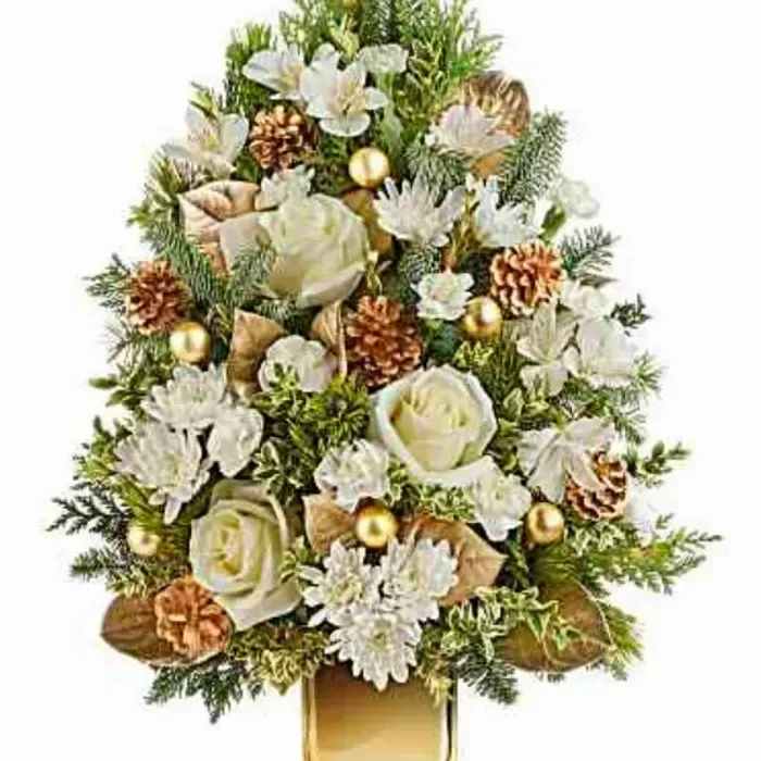 Golden Winter Tree Bouquet Golden Winter Tree Bouquet - he stunning tree bouquet features white roses, white alstroemeria, white miniature carnations, and white cushion spray chrysanthemums, accented with fresh lemon leaf, oregonia, cedar, noble fir, and white pine. Delivered in Teleflora's Gold Mirrored Cube, it exudes timeless elegance and festive charm.