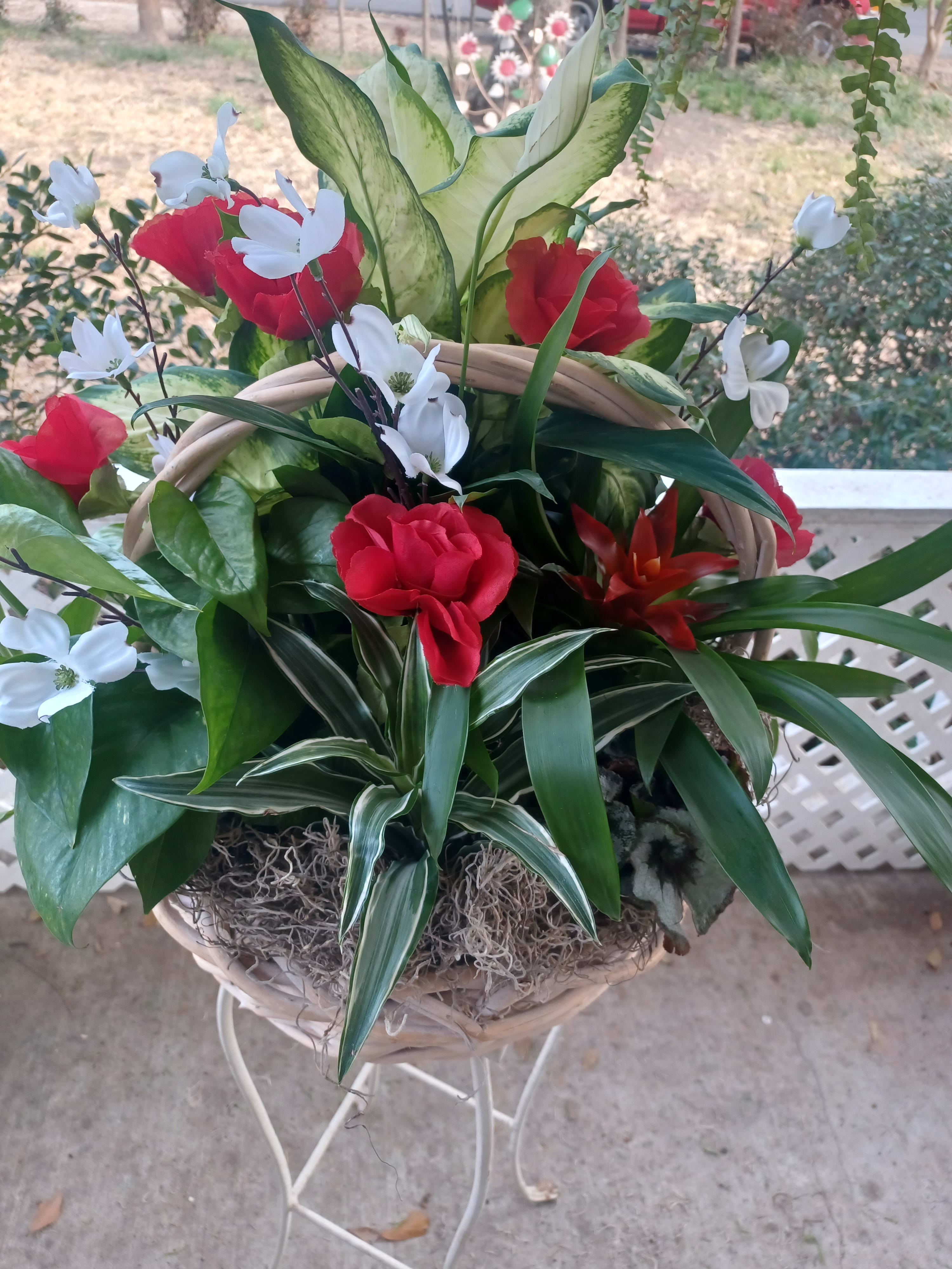 Pretty Planter Pretty Planter - A mixed planter basket with a variety of low maintenance house plants and pretty artificial flowers added in a wicker basket with Spanish moss added.