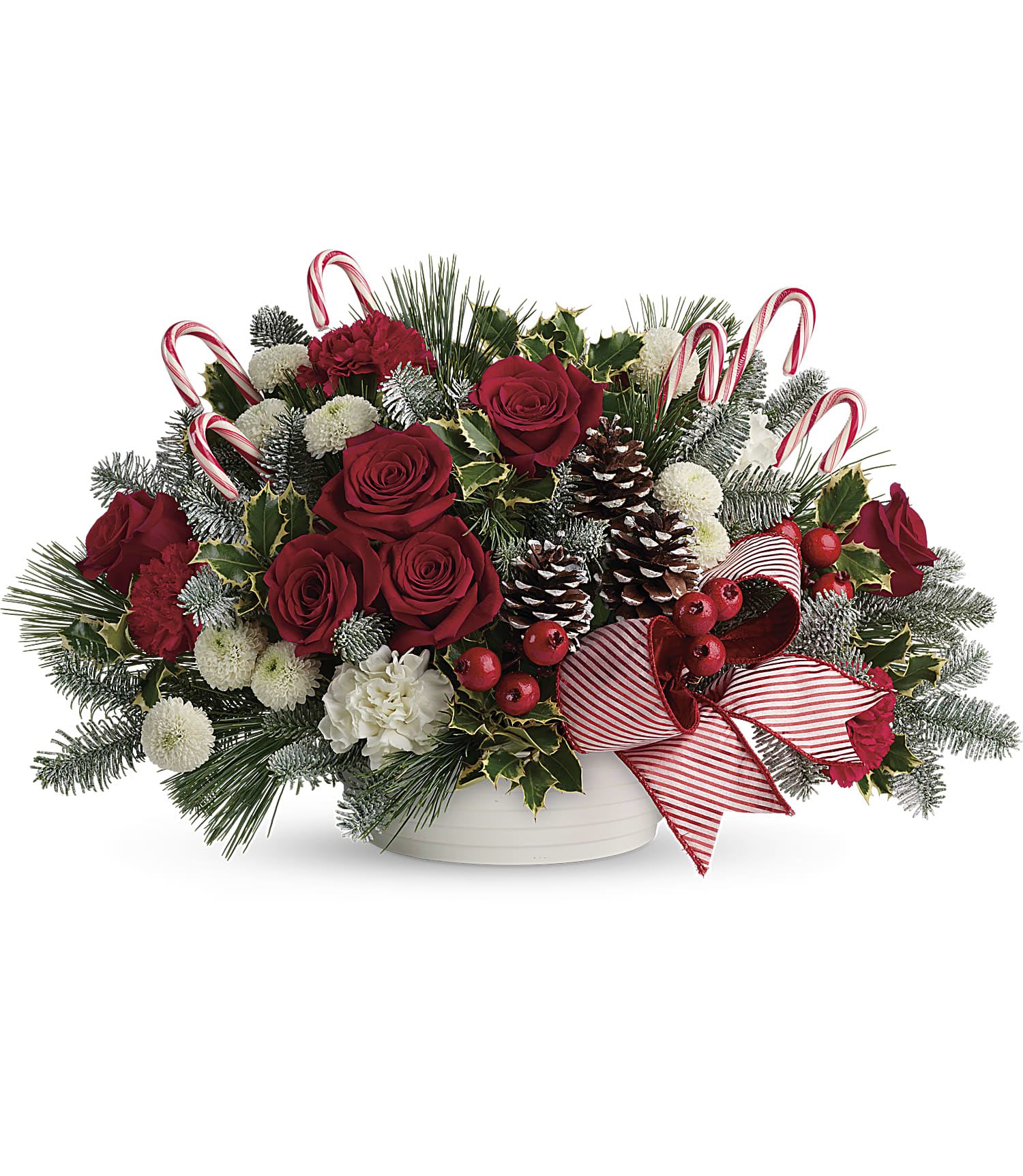 Jolly Candy Cane - A charming and delightful centerpiece including red roses, Christmas greens, pine cones, and candy canes.