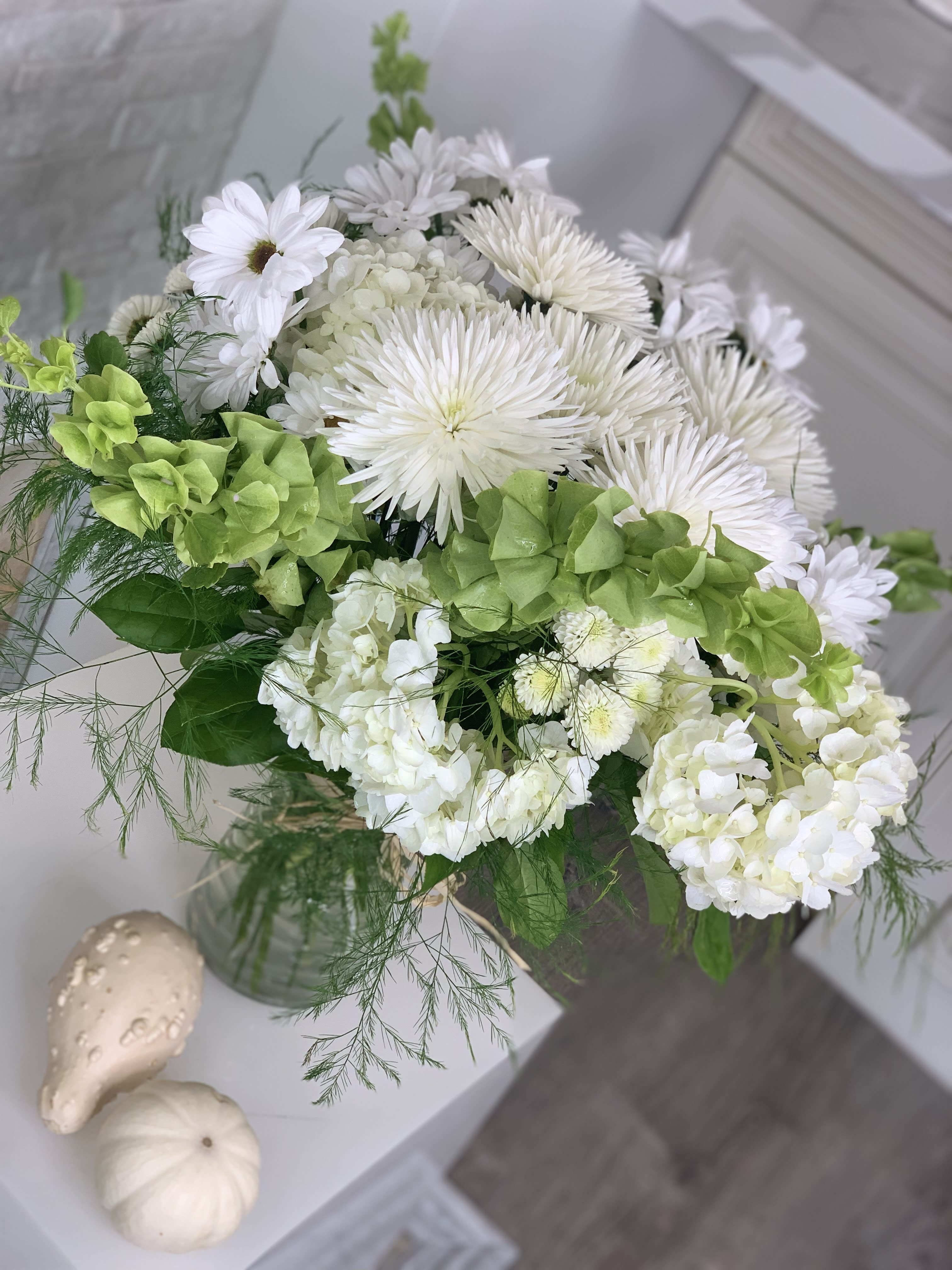 Daisy and Aster Mix  - This arrangement is full of variety of daisies and asters with hydrangeas and spring greenery. It gives a full, good, clean and fresh impression. Something different from roses. It can be created in different colors  as well.  