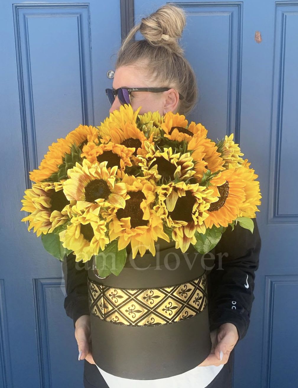 The Sun in the Box  - A luxury box full of sunflowers is bringing a burst of sunshine to you in Ramona and all of sunny Southern California. Professionally crafted by your local florist, 'I am Clover' in Ramona, this arrangement captures the radiant beauty of summer.&quot;  This luxury floral box is overflowing with premium sunflowers, artfully arranged to captivate your senses and brighten your day. Crafted with creativity and care by 'I am Clover' in Ramona, California, this stunning display brings the vibrant essence of summer right into your home.&quot;  DELIVERY TIMES ARE USUALLY BETWEEN 2:30 PM THROUGH 6:30PM ON THE DAY OF DELIVERY. FOR SAME DAY ORDERS, PLEASE GIVE US AT LEAST 6 HOURS TO PROCESS AND DELIVER THE FLOWERS AS PRIOR ORDERS WILL BE PRIORITIZED. MORNING DELIVERY REQUESTS AND SPECIFIC TIME REQUESTS WILL BE AN ADDITIONAL $15 FOR A CONVENIENCE FEE CHARGE. OTHERWISE, SPECIFIC TIMES ARE ACKNOWLEDGED AND WE WILL DO OUR BEST TO ACCOMMODATE, HOWEVER WE CANNOT GUARANTEE ON TIME DELIVERY. GATE CODES ARE MANDATORY FOR OUR DELIVERY DRIVERS TO BE ABLE TO ENTER RESIDENTIAL OR COMMERCIAL BUILDINGS. IF YOU DON’T KNOW THE GATE CODE FOR A DELIVERY, PLEASE CONTACT THE RECIPIENT AND PROVIDE US WITH IT OR OUR DRIVER CAN CONTACT THE RECIPIENT BEFORE BEGINNING A DELIVERY ROUTE TO OBTAIN THE CODE. OUR POLICY STATES THAT DRIVERS WILL ONLY WAIT FIVE MINUTES OUTSIDE THE GATE FOR A CALLBACK. 