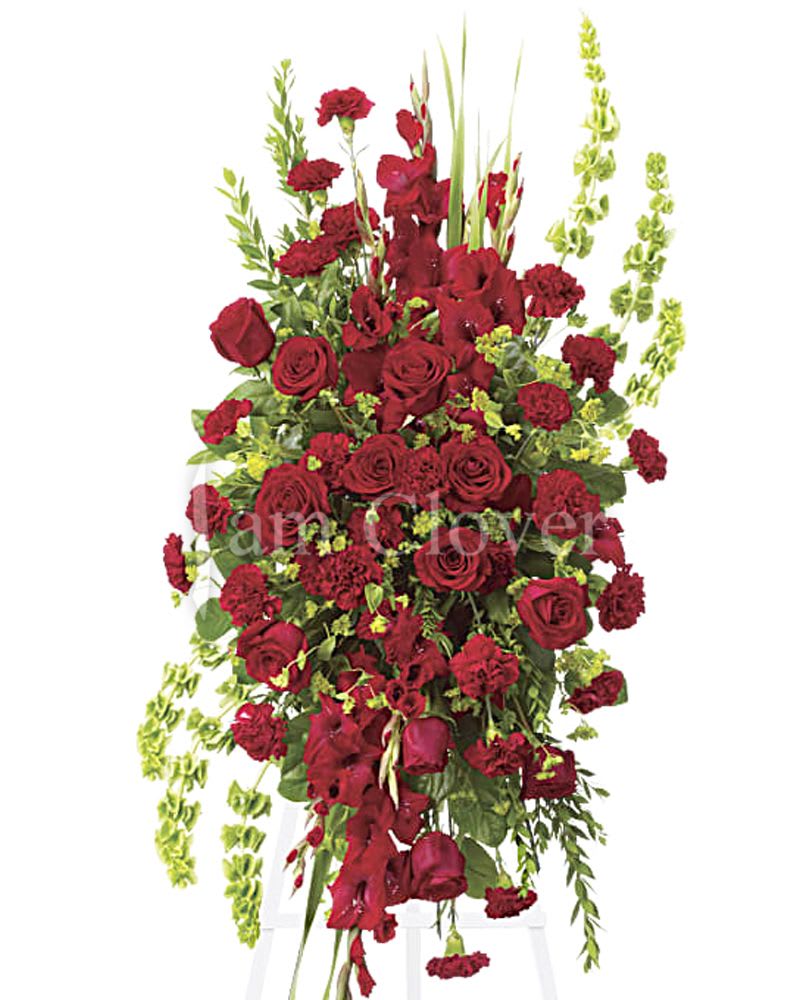 Red Roses Standing Spray  - Red roses convey a profound sense of devotion and honor. They are an ideal choice for paying tribute to a loved one, symbolizing love, respect, and admiration.   Fulfill your floral needs at I Am Clover in Ramona, CA, and experience the difference in quality, freshness, and care that comes with ordering locally.   Delivery: 2:30pm - 6:30pm Same Day Orders may take at least 6 hours to process and deliver Morning and Specific Delivery Time Requests:  will be charged a $15 convenience fee. Specific delivery times are acknowledged and we will do our best to accommodate, however we cannot guarantee on time delivery due to unforeseen events.  Gate Codes are mandatory for our delivery drivers to enter residential or commercial buildings. If you don’t know the gate code for a delivery, please contact the recipient and provide us with it or our driver can contact the recipient before beginning a delivery route to obtain the code. Our drivers will only wait five minutes outside the gate for a callback. If a driver has to leave a property, the delivery is reassigned for the next day and may charge an additional delivery fee.   Thank you! 