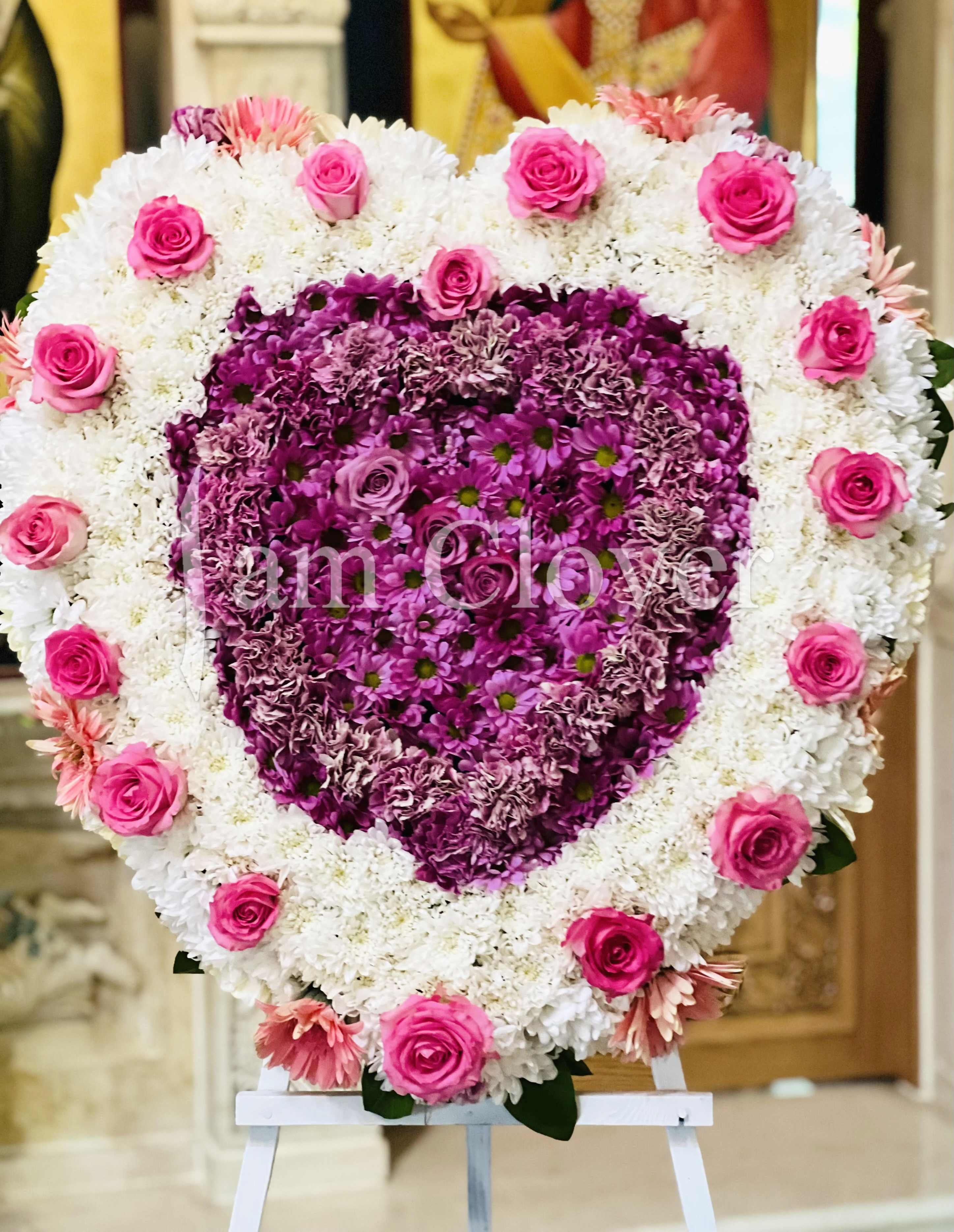 Zinetta's Heart Zinetta's Heart - This stunning heart wreath will express the love and legacy just the way you wanted. Comes in the sizes: Medium 22 inches & Large 28 inches Fulfill your floral needs at I Am Clover in Ramona, CA, and experience the difference in quality, freshness, and care that comes with ordering locally. Disclosure: Occasional substitutions of flowers happen due to weather, seasonality and market conditions. We will ensure that the style, theme and color scheme of your arrangement is preserved and will only substitute items of equal value or higher value. Delivery: 2:30pm - 6:30pm Same Day Orders may take at least 6 hours to process and deliver Morning and Specific Delivery Time Requests: will be charged a $15 convenience fee. Specific delivery times are acknowledged and we will do our best to accommodate, however we cannot guarantee on time delivery due to unforeseen events. Gate Codes are mandatory for our delivery drivers to enter residential or commercial buildings. If you don’t know the gate code for a delivery, please contact the recipient and provide us with it or our driver can contact the recipient before beginning a delivery route to obtain the code. Our drivers will only wait five minutes outside the gate for a callback. If a driver has to leave a property, the delivery is reassigned for the next day and may charge an additional delivery fee. Thank you!