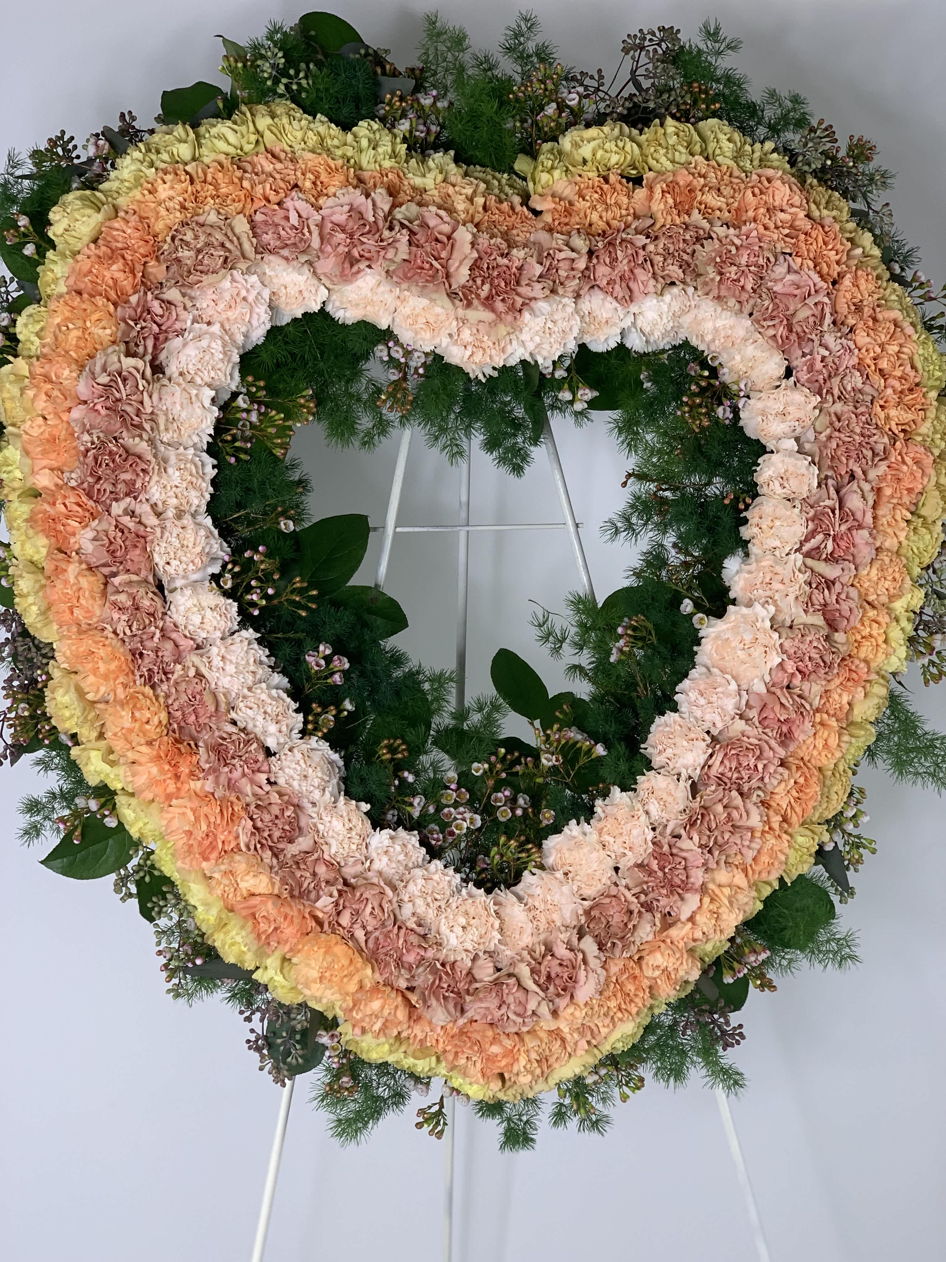 Peach Floral  Heart on the Easel - Peach Floral  Heart on the Easel is a stunning piece that will fully express your feelings and show respect. Sizes  Small  Medium Large