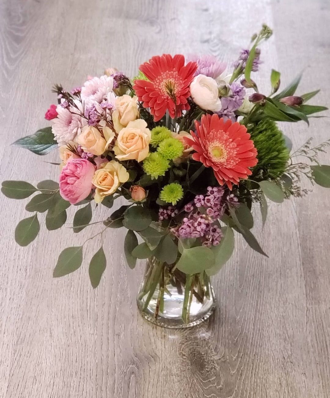 Spring Posy Arrangement Spring Posy Arrangement - A spring mix designed with pastel in season blooms. Blooms may vary due to availability. Picture is premium size