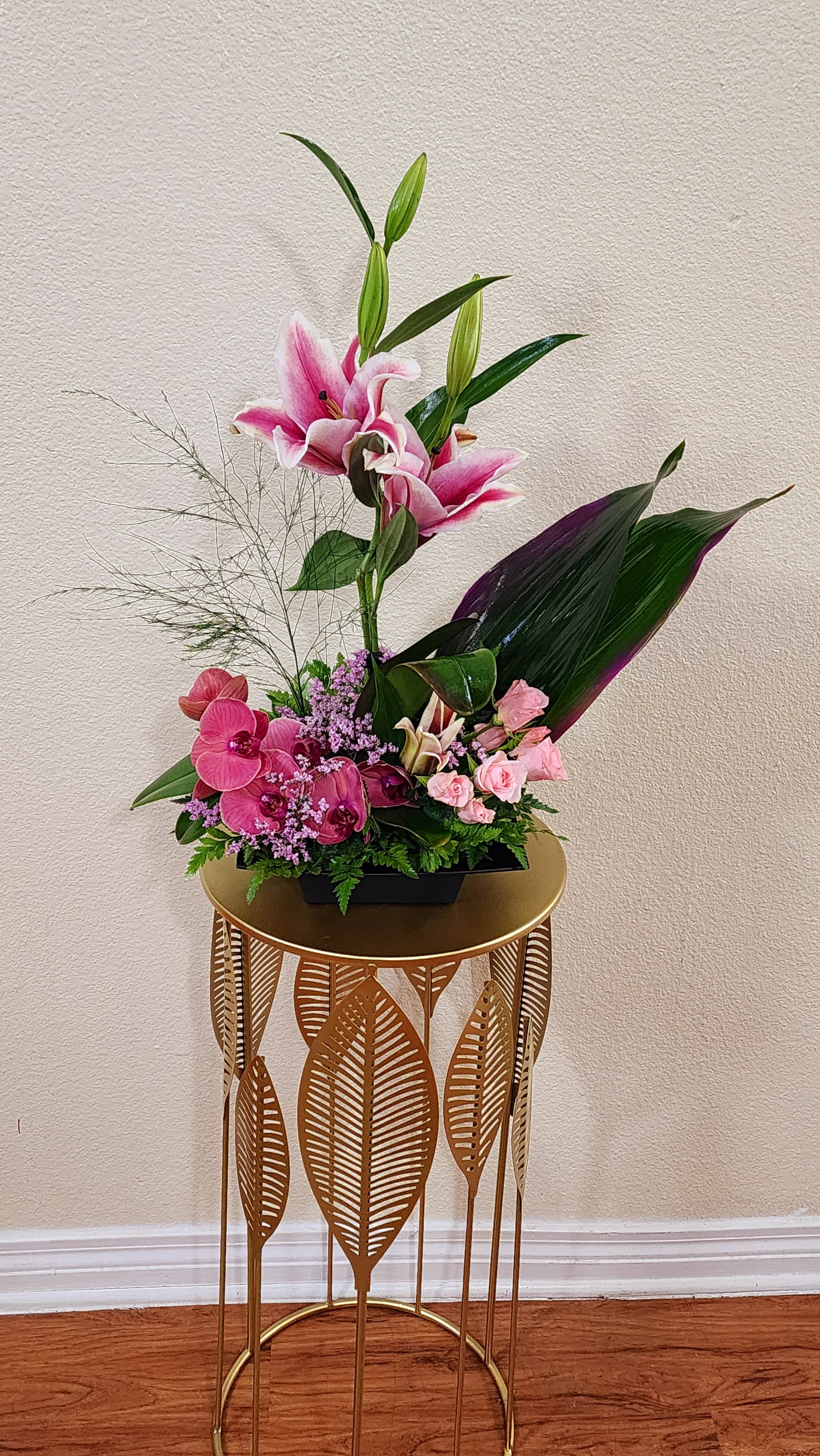 Concord Garden - A lovely mix of blooms such as orchids, spray roses and lilies.