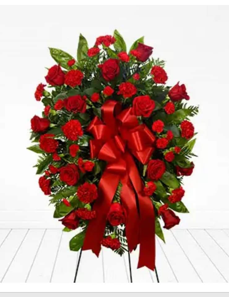 RED GLORY STANDING SPRAY RED GLORY STANDING SPRAY - THIS BEAUTY IS ALL RED BUT CAN BE CUSTOMIZED IN ANY COLORS. WHAT A PHENOMENAL WAY TO SAY YOUR FINAL GOODBYE. THIS spray is 24 by 20