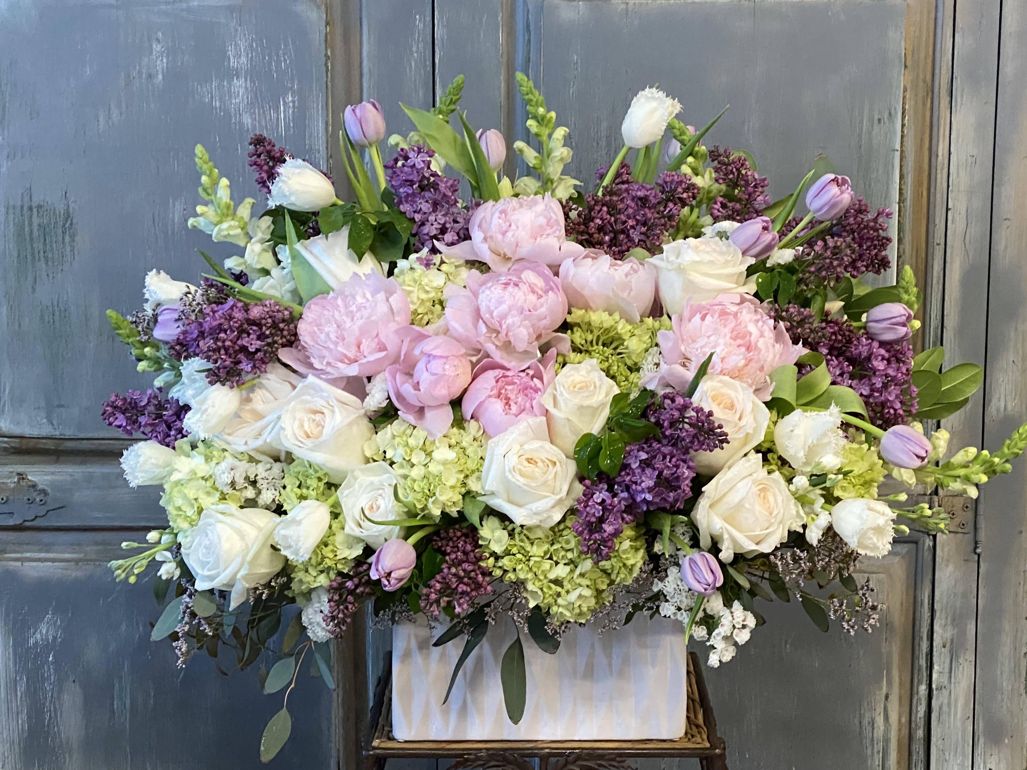 Violet Romance Violet Romance - This is an arrangement of lilacs, peonies, roses and many other high end flowers, a perfect gift for someone who loves and adores especially lilacs and peonies