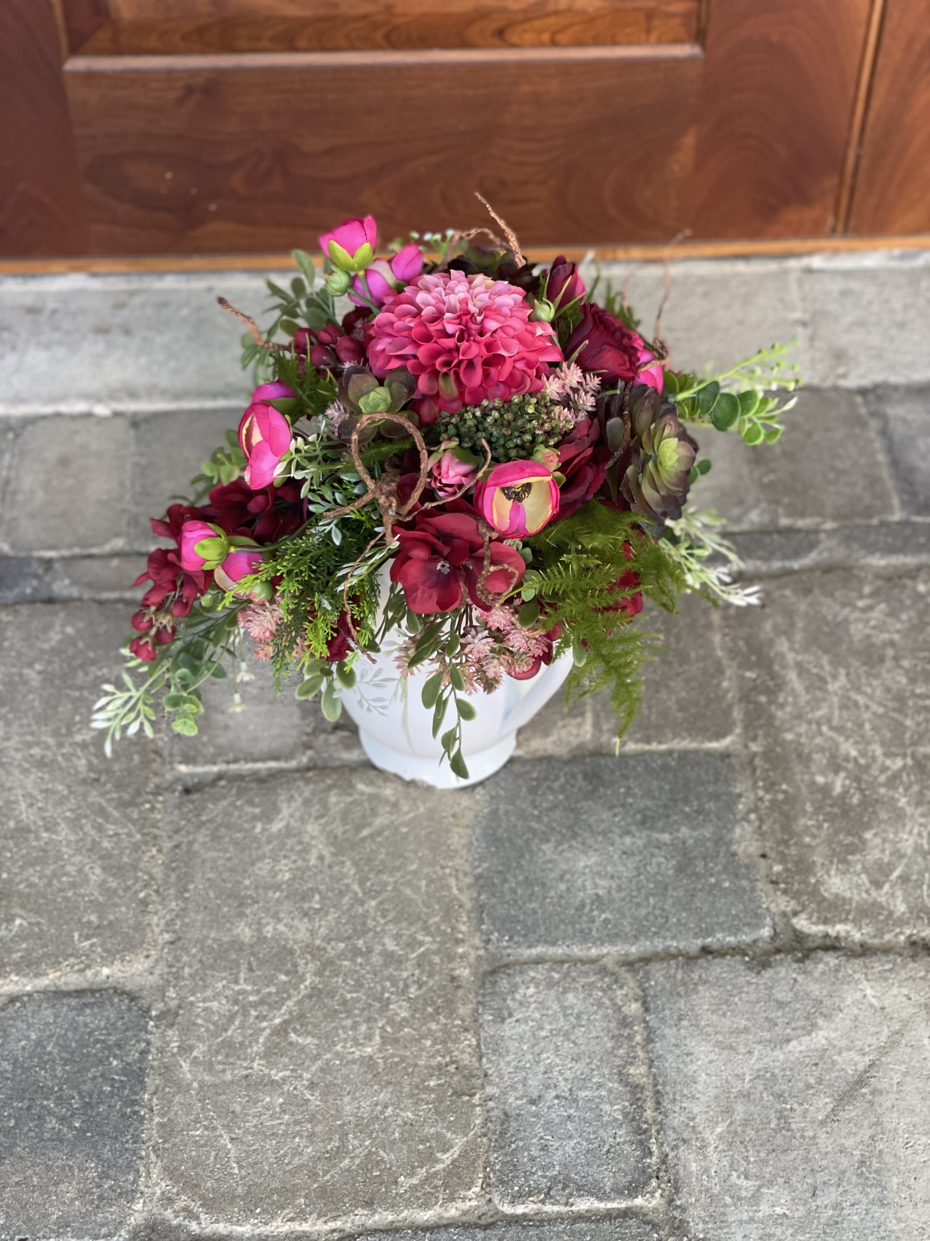 Cascading Fall Artificial ail Bride Bouquet Cascading Fall Artificial ail Bride Bouquet - Stunning pinks and red bride bouquets perfect for anytime of year. Enjoy its beauty forever without wilting or browning. Made with the highest quality silk dahlias, anemones, ranunculus and succulents.