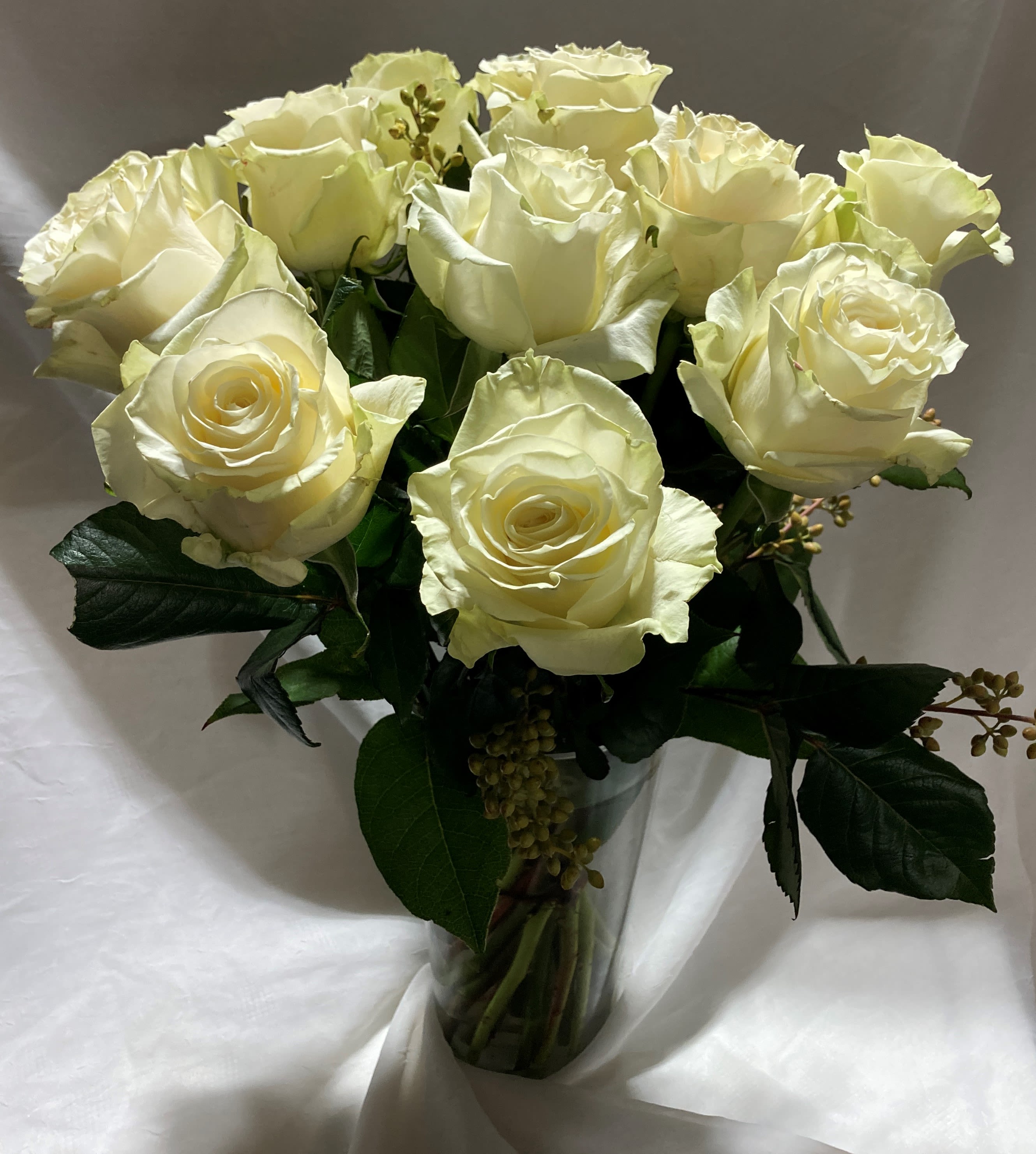 White rose bouquet - When only white roses will do, enjoy this lovely bouquet of beautiful long-stemmed white roses in a stunning gold-stemmed vase.  