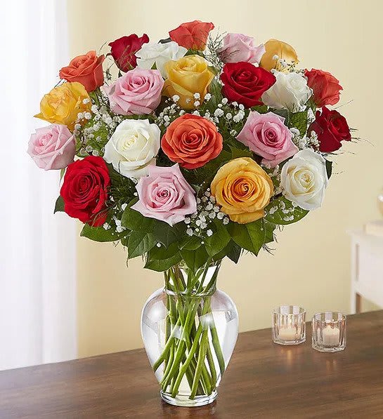 Roses in Assorted Colors - Our rainbow of long stem roses is the ultimate surprise for letting someone know how you feel. Two, three or four dozen blooms in a of stunning array of colors are artistically arranged by our expert florists inside an elegant glass vase and personally hand-delivered to help you beautifully express what’s in your heart.