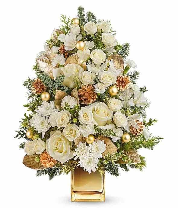 Radiant Golden Holiday Tree - Delight someone special with this elegant Holiday tree-shaped floral arrangement. Featuring beautiful white roses, carnations, and chrysanthemums accented with gold pinecones, ornaments, and lush evergreens, it creates a stunning holiday centerpiece. Presented in a stylish gold vase, it's a perfect gift to bring festive cheer and brighten any space this season. 