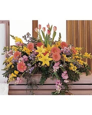 Blooming Glory Casket Spray Blooming Glory Casket Spray - This colorful half-couch spray blooms with bright flowers, promising that there's always hope and glory. One half-couch casket spray is decorated with yellow lilies and snapdragons, pink gerberas, lavender stock, pink tulips and lavender waxflower. Approximately 44" W x 37" H Orientation: All-Around As Shown : TF199-7