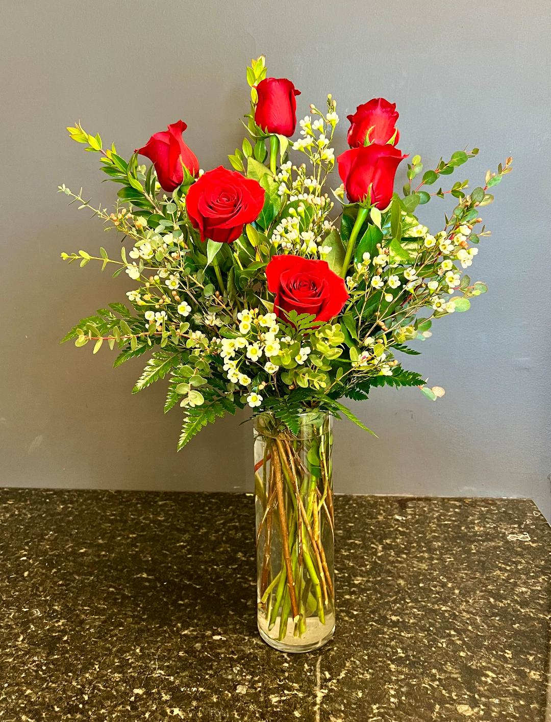 Half Of My Love - 6 Red Roses arranged in a vase with all mixed greeneries and filler