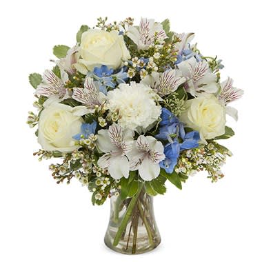 White and Blue Bliss - This arrangement is perfect for those &quot; just because &quot; moments. Filled with roses, carnations,  blue delph, alstroemeria, wax and fresh greens.