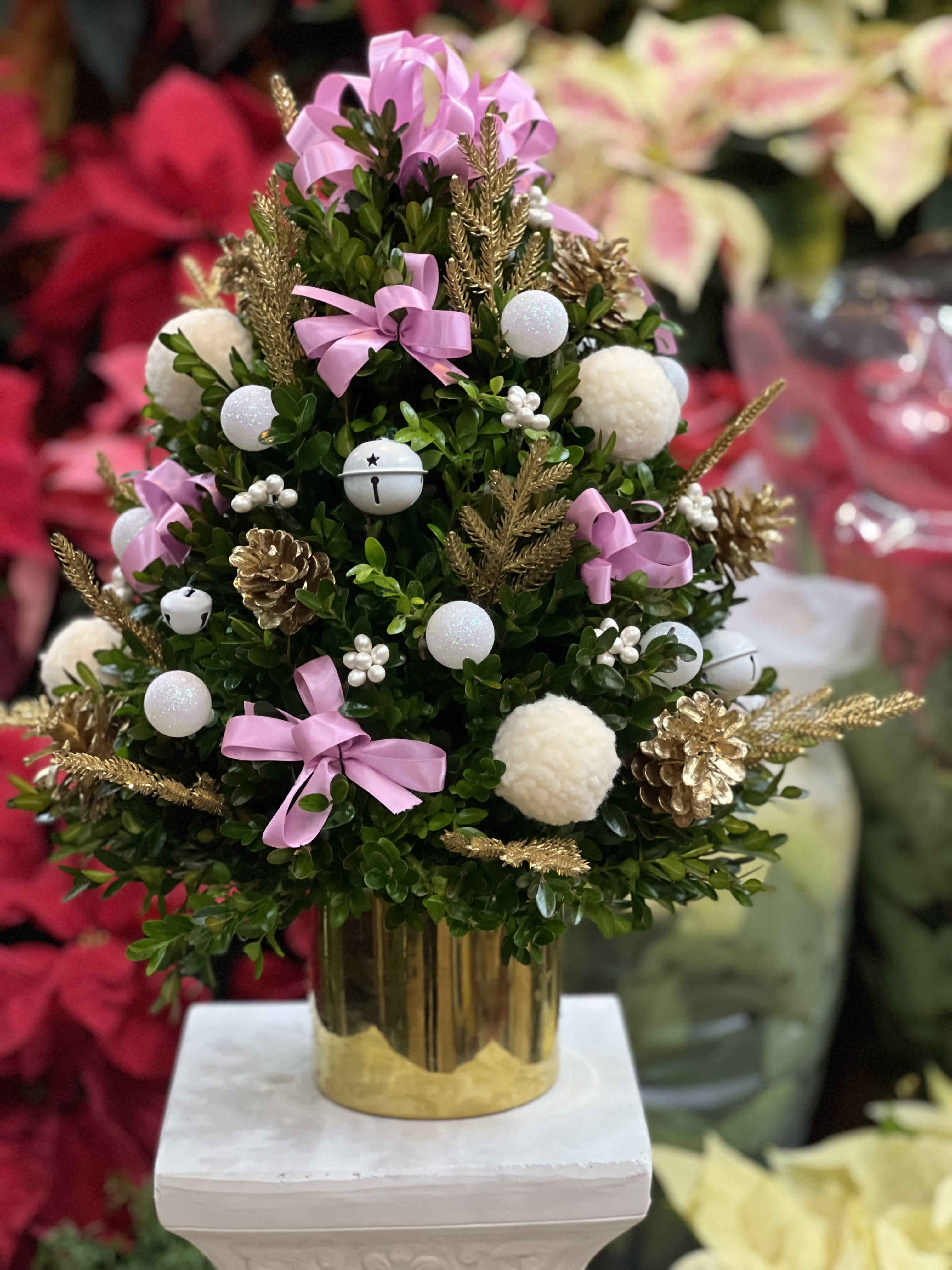 The coquette  - This lovely coquette hand crafted boxwood tree with the colors pink and white, is perfect for a table top centerpiece or just as room decoration !