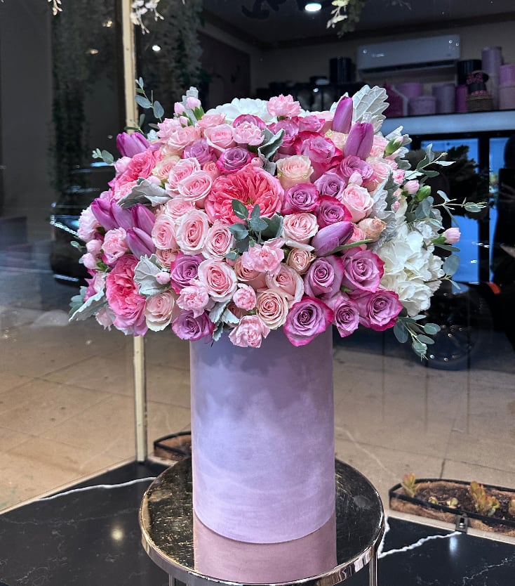 Lavender lullaby Lavender lullaby - Brighten any space with our Elegant Flower Box Arrangement! Bursting with vibrant blooms, this stunning display combines seasonal favorites with lush fillers. Housed in a chic, reusable container, it makes a perfect centerpiece for any occasion be it a gift or a treat for yourself. Elevate your decor with this captivating arrangement that brings joy and sophistication to your home or office. Order yours today and let the beauty of flowers inspire you!
