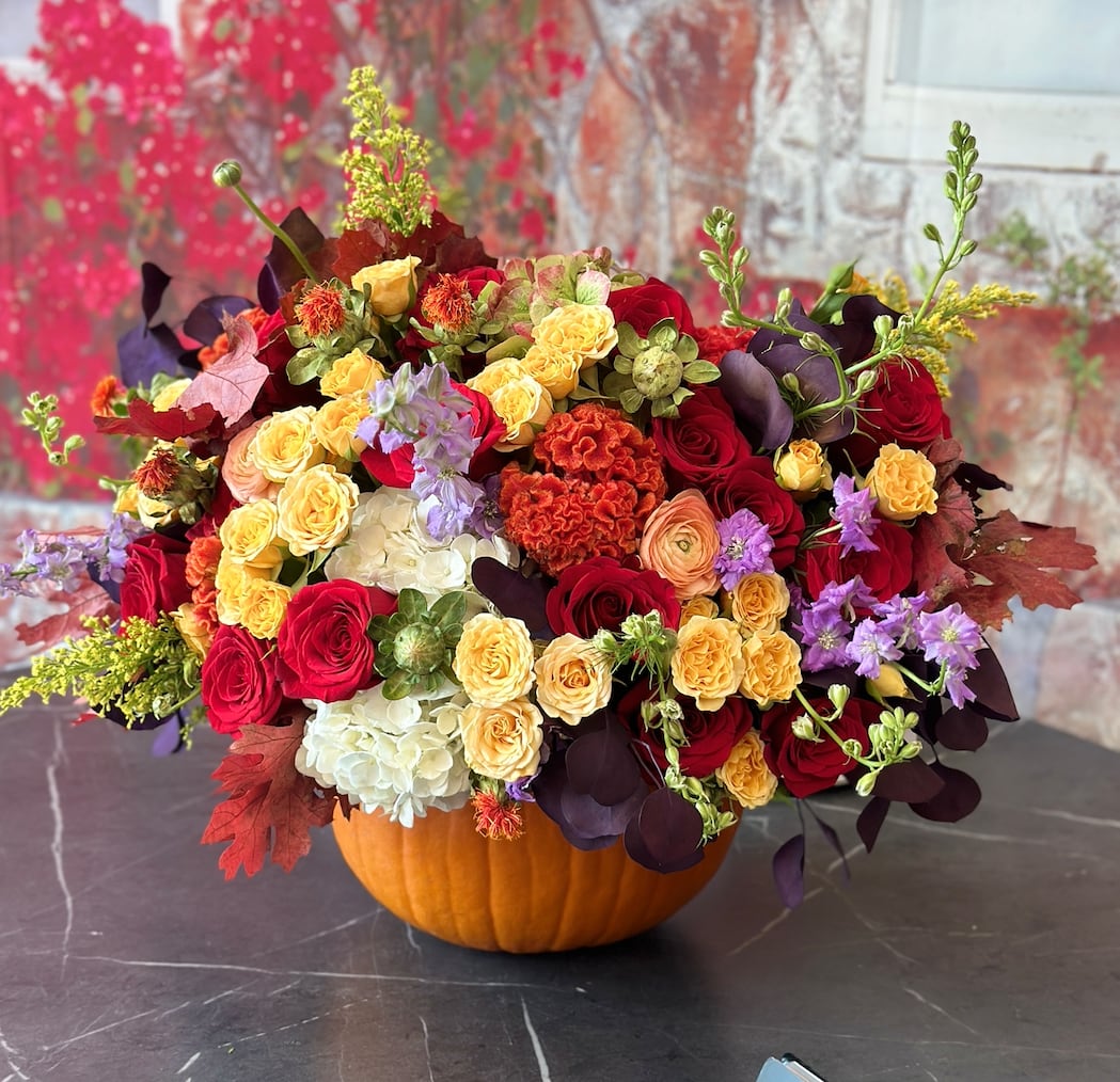 Pumpkin delight Pumpkin delight - Brighten your autumn celebrations with our Limited Edition Fall Pumpkin Floral Arrangement! Bursting with vibrant seasonal blooms, this stunning display is artfully arranged in a fresh pumpkin, creating a unique centerpiece that captures the essence of fall. Perfect for gatherings or as a thoughtful gift, this arrangement adds warmth and charm to any space. Elevate your decor with this captivating piece that brings joy and seasonal spirit to your home or office. Don’t miss out—order your exclusive Fall Pumpkin Floral Arrangement today and let the beauty of autumn inspire you!
