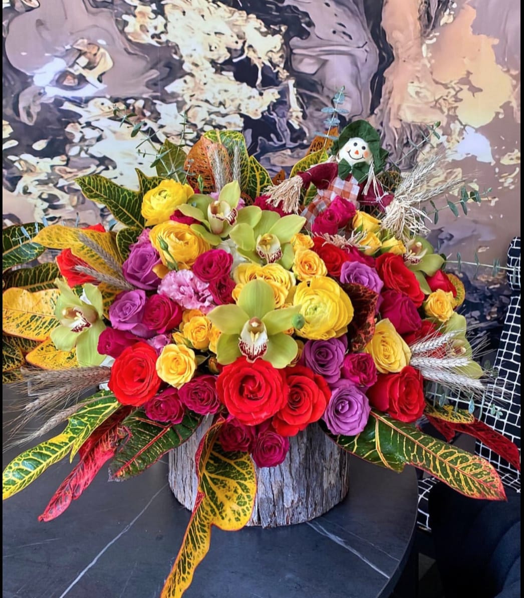 Harvest dreams Harvest dreams - Brighten any space with our Elegant Flower Vase Arrangement! Bursting with vibrant blooms, this stunning display features seasonal favorites artfully arranged with lush greenery for a striking effect. Perfect for any occasion, it makes a thoughtful gift or a lovely addition to your home decor. Elevate your surroundings with this captivating vase arrangement that brings joy and sophistication to every room. Order yours today and let the beauty of flowers inspire you!