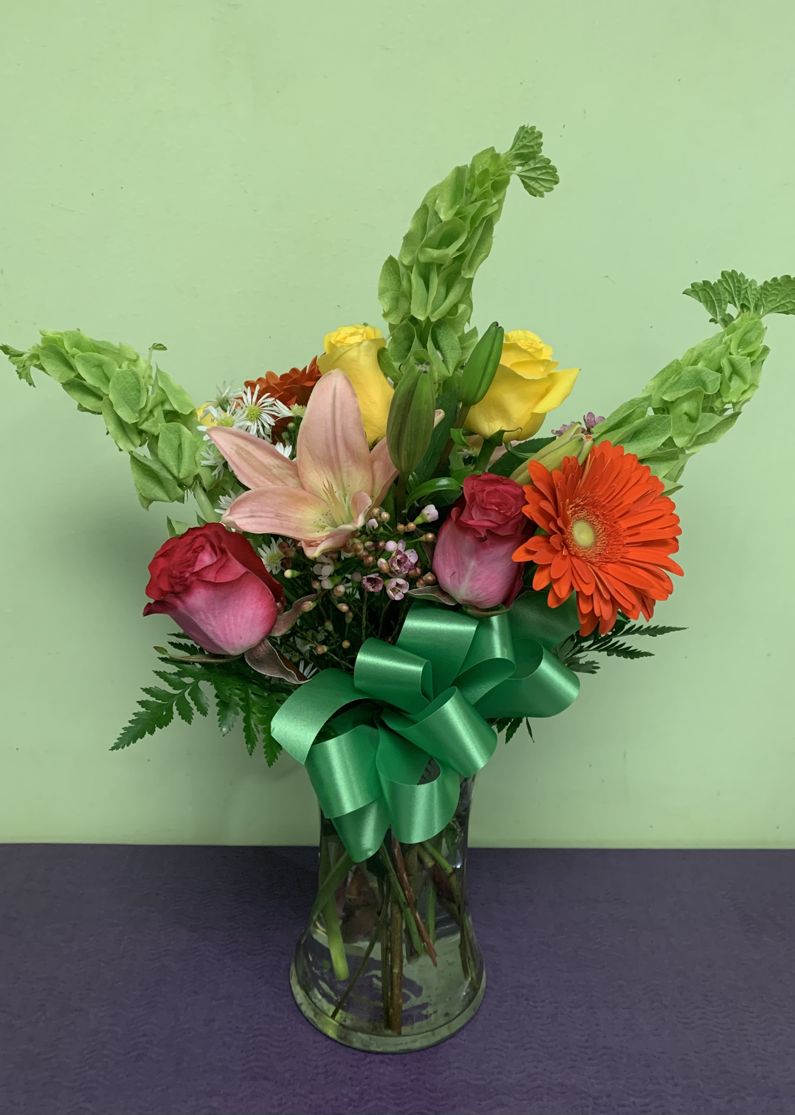 Ring in Spring! - IT'S SPRING!! Time for nicer weather and fun times outside! Send some flowers to the one you love to let them know you can't wait to spend the season with them. The arrangement includes Bells, of Ireland, LIlies, Gerber Daisies, and Roses.