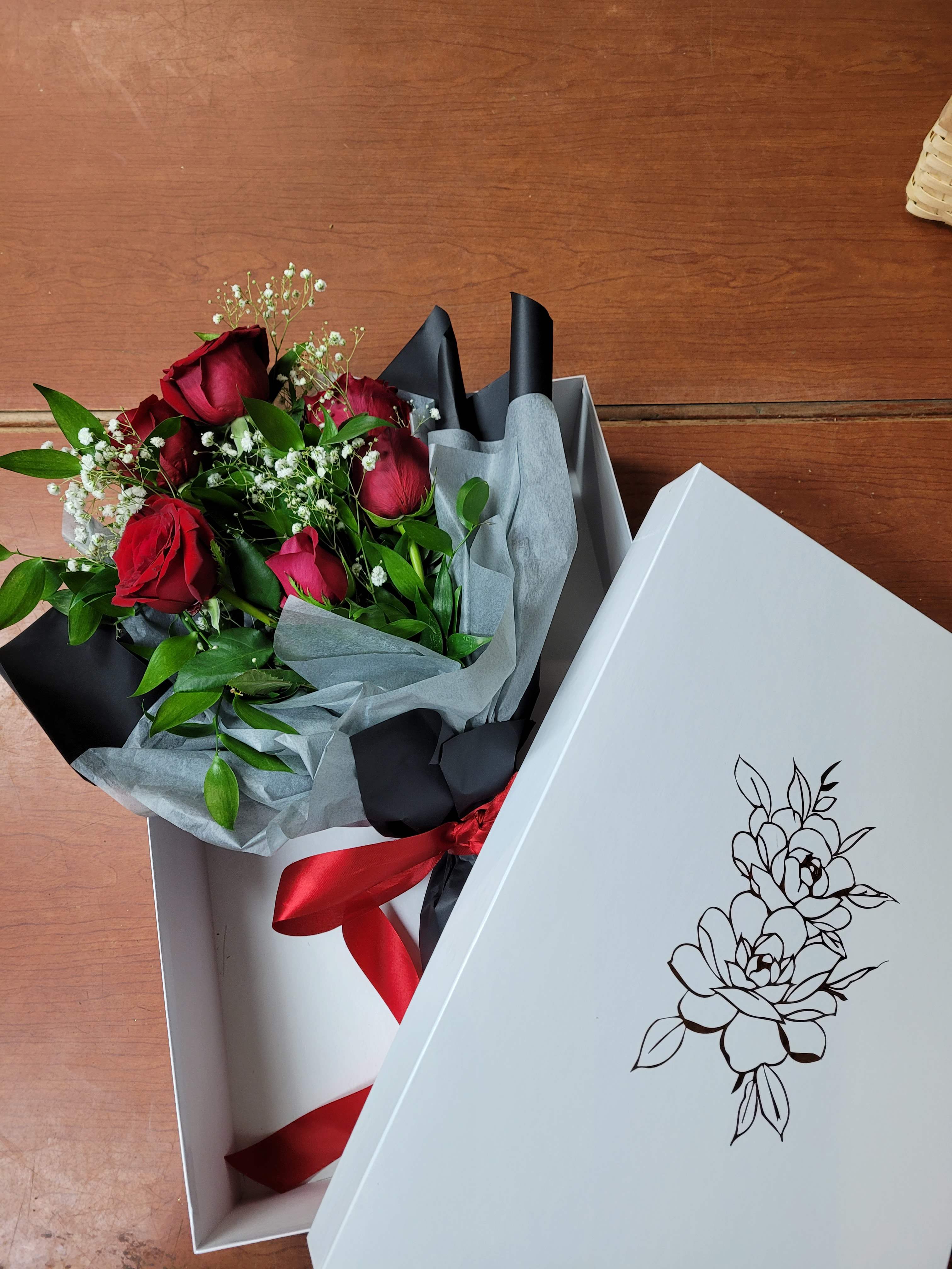 Designers Choice Custom Bouquet  - a collection of seasonally available blooms wrapped in our specialty wrapping and packed in a beautiful box. Perfect for any gift 