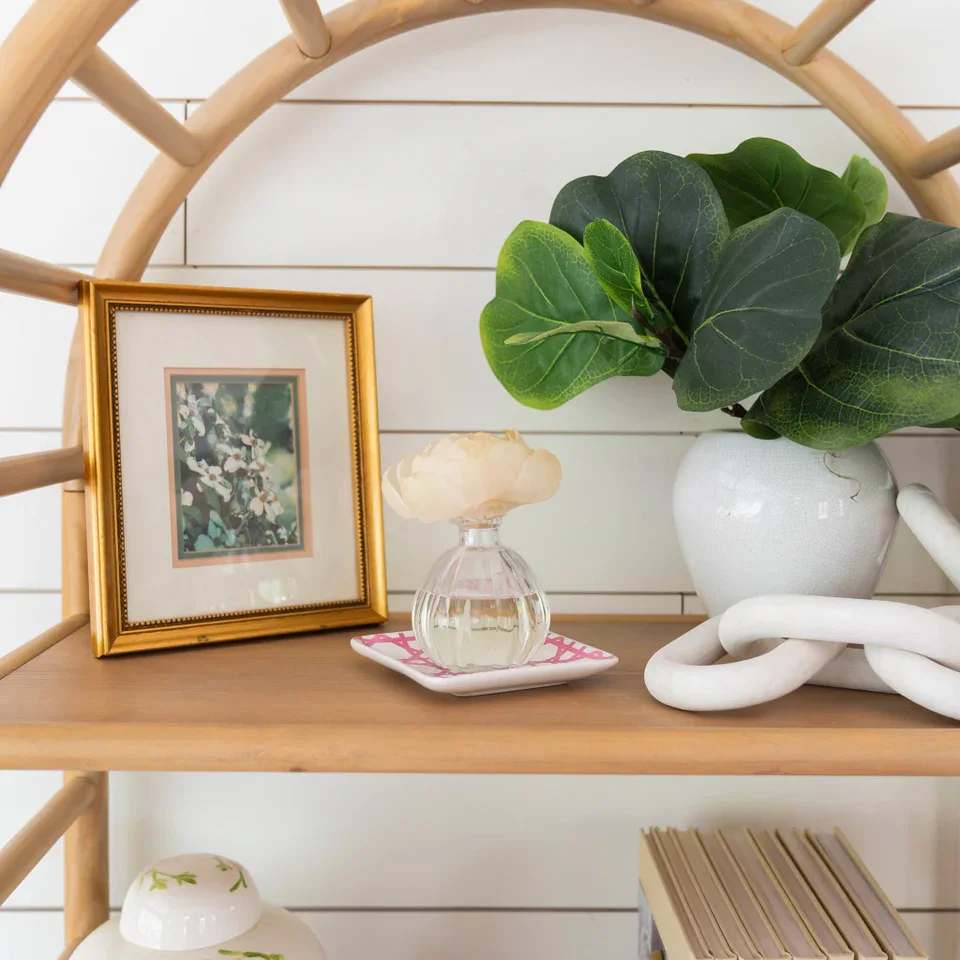 Peony Bloom Flower Diffuser - Our Flower Diffuser includes your favorite Greenleaf fragrance oil and a sola paper flower that emits a beautiful, blooming scent for up to 60 days! As the fragrance oils are absorbed through the wick, the flower begins to “bloom,” slowly emitting the fragrance and eventually resembling real flower petals.   Did you Know? You can use a Refill! Bring your Flower Diffuser back to life by using the entire contents of one of our Reed Diffuser Oil Refills in the same fragrance to enjoy your Flower Diffuser one additional time after initial use.  What Makes it Special: Beautiful fragrance created in-house by a team of professional perfumers Through Greenleaf Cares, proceeds of this product support organizations in the fight to end human trafficking  Fragrance: Peony Bloom Fragrance Family: Floral Fragrance Description: With bright, beautiful blooms and energizing green grasses, Peony Bloom is truly exhilarating and unbelievably romantic.  Use and Care: Place diffuser vase on a flat, stable surface Holding glass at base, carefully twist the cork out of the container Extend the stem of the flower fully and place it into the bottle, ensuring that the wire located within the wick is fully inserted into the neck of the container Enjoy the fragrance as well as the beauty of the flower as it blooms for up to 60 days When all the oil has been diffused and the flower begins to dry out, replace your Flower Diffuser