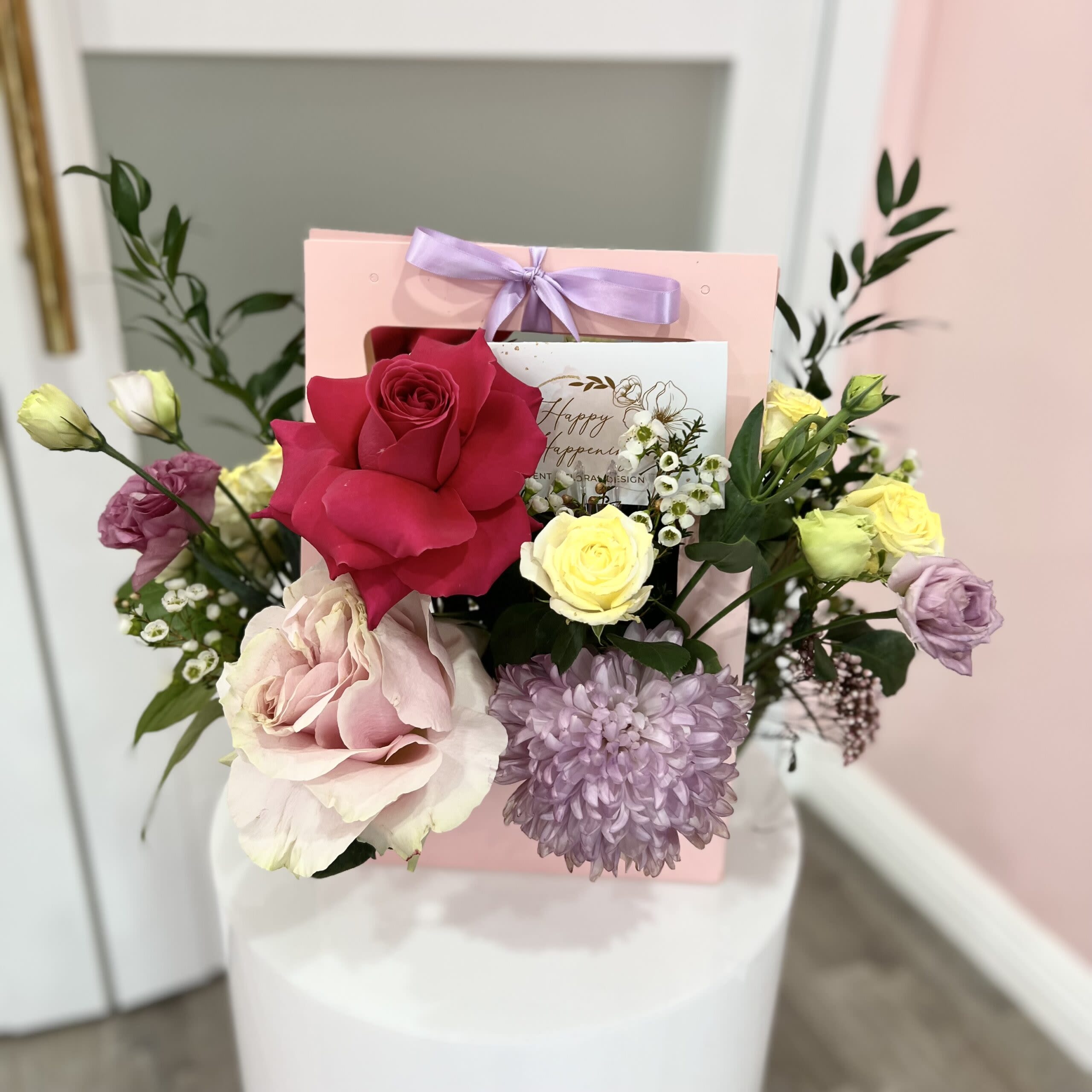 Chic Floral Tote - Say I love you with our beautiful all in red roses arrangement with an eruption of tulip in our signature black box.  