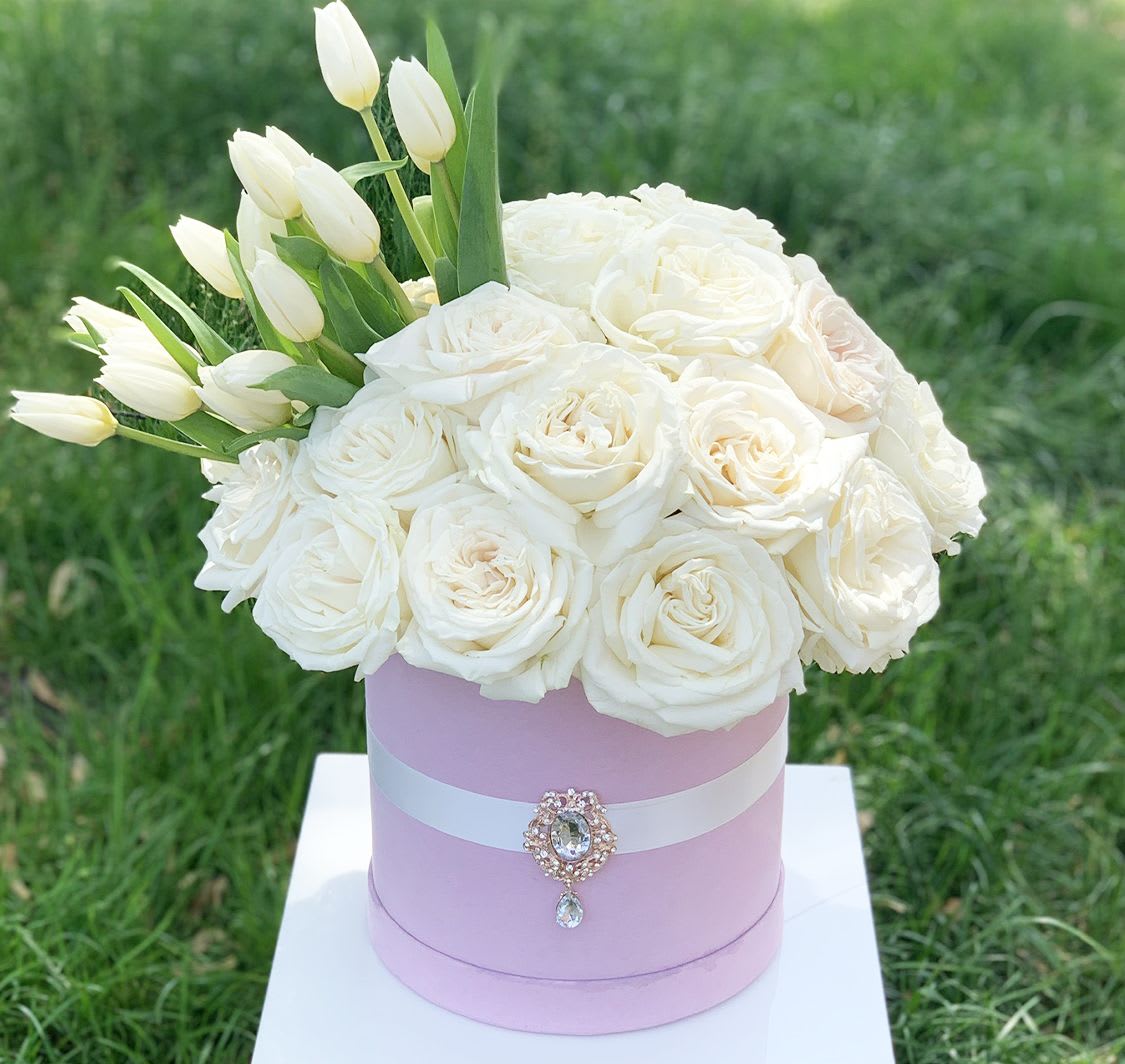 Timeless Elegance - All white premium garden roses with an eruption of tulips in our luxury velvet box perfectly styled with a satin ribbon &amp; crystal brooch. Simple beauty &amp; elegance!  Our modern flower box arrangement is the perfect gift for birthdays, anniversaries, or just because. 