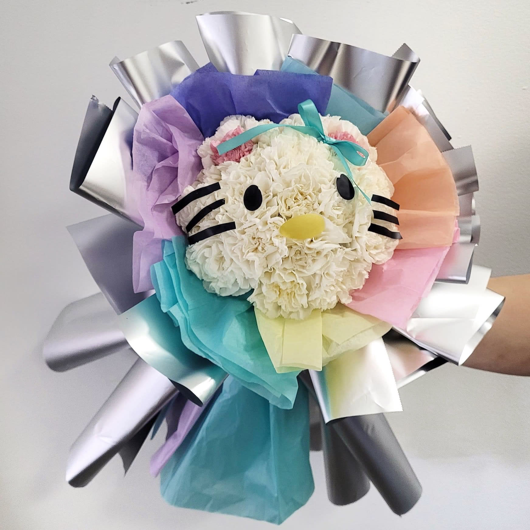 HK floral HK floral - A Hello Kitty themed hand tied bouquet The bouquet pictured reflects our original design for this product. While we always try to follow the color palette, we may replace stems to deliver the freshest bouquet possible, and we may sometimes need to use a different vase. We have a simple goal – delight our customers with flowers that are high quality, fresh, and beautiful. While we may occasionally need to substitute for color or flower variety, we promise that the blooms you receive will be fresh and wow you or your gift recipient.