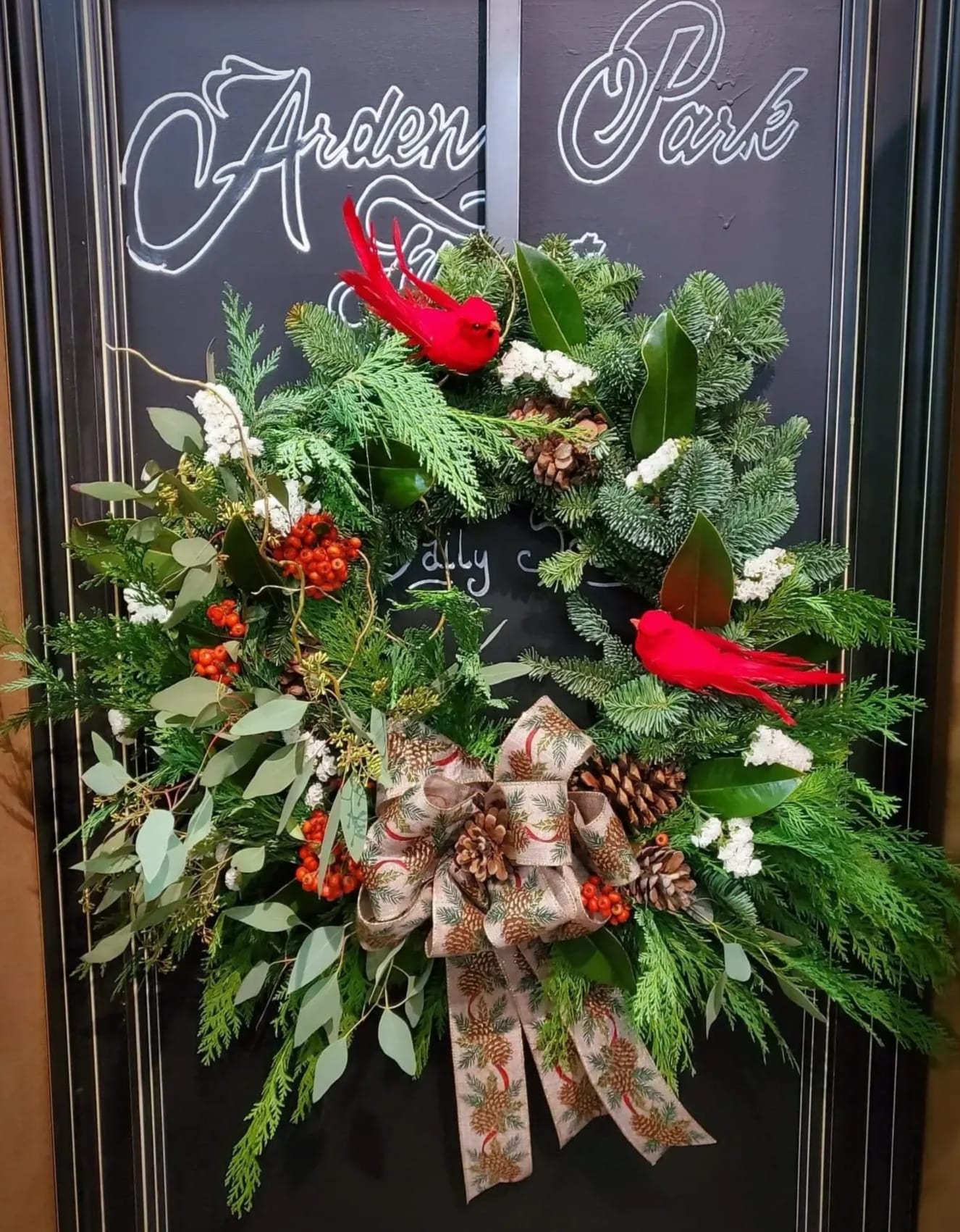 Fresh Winter Wreath Fresh Winter Wreath - This Aromatic Hand Made Fresh evergreen wreath makes the perfect holiday adornment for any door, home or office. Ribbon May vary but overall look and feel will be kept ** Deluxe is Pictured**