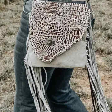 Myra Cowhide Western Fringe Bag - Crossbody - The Crocodile-embossed leather flap on the front of the purse with a leather back is the neutral purse you need in your closet. An adjustable leather shoulder strap for the perfect fit. One exterior zipper pocket on the back. 