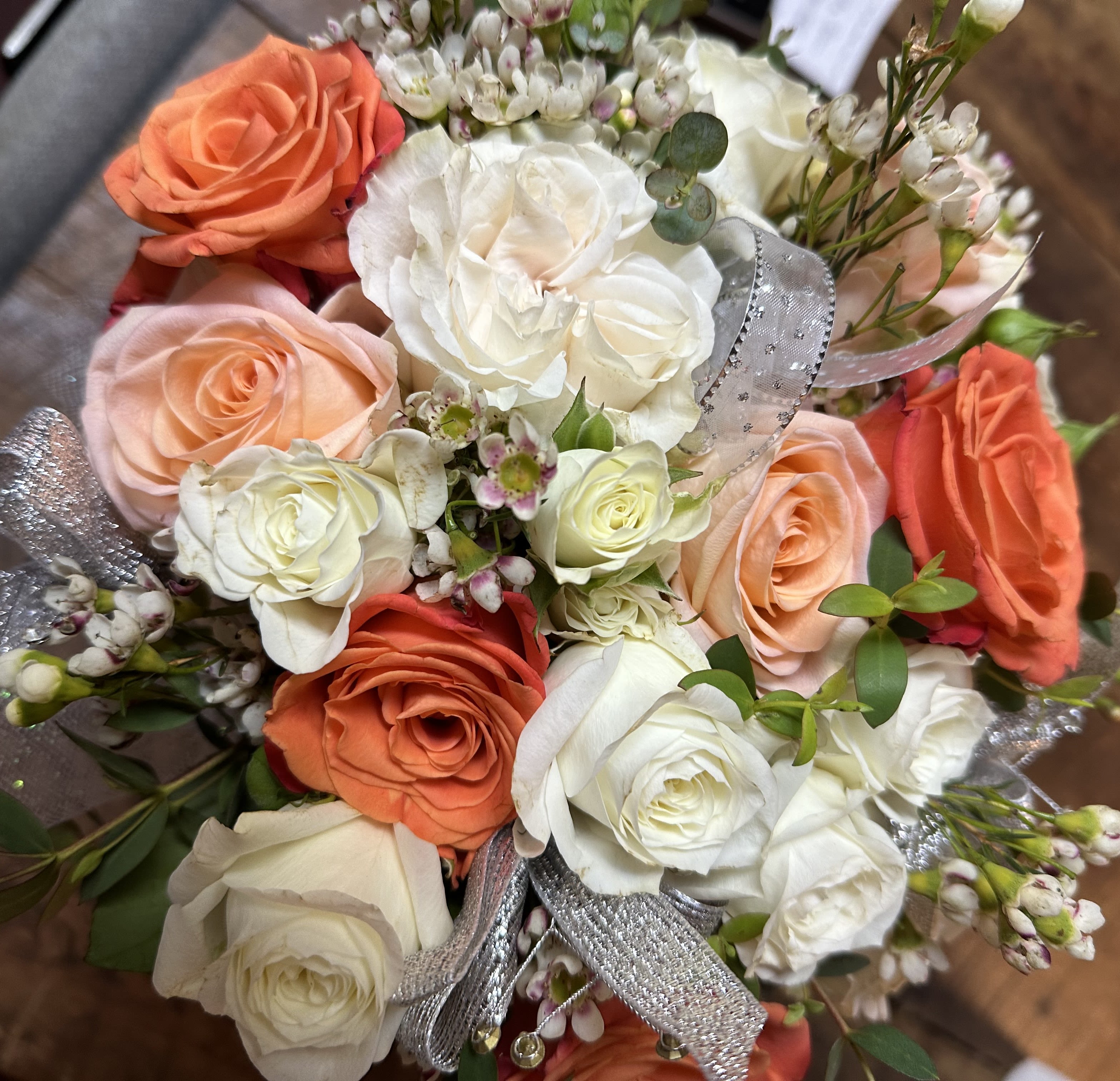 Hand Held Prom - Orange, White, Soft Pink Roses and Wax Flower, and Greenery