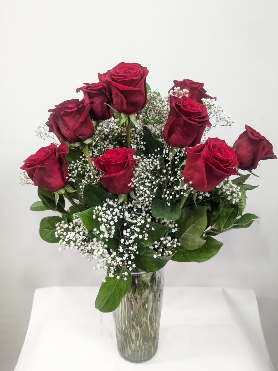 Dozen Long Stemmed Red Roses with Baby's Breath - These dozen red roses with baby's breath are classic! Perfect romantic gift for Valentine's Day or an Anniversary.   APPROXIMATE DIMENSIONS: 25&quot; H X 18&quot; W
