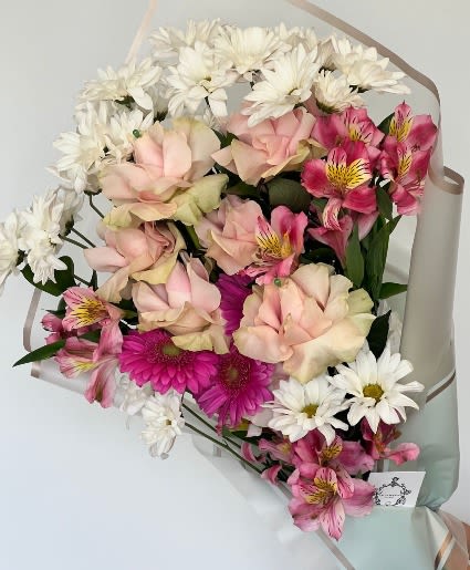 Sweet Pink Wrapped Bouquet  - Stunning soft pink variety of roses, alstroemeria, gerbera daisies, and white daisies. 