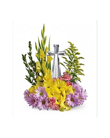 Crystal Cross Bouquet Crystal Cross Bouquet - Celebrate the reason for the season with radiant flowers cradling an exquisitely crafted Crystal Cross. This lovely gift will be a source of inspiration for years to come. Yellow gladioli lavender daisy spray chrysanthemums pink carnations and solidago accented with assorted greenery are delivered with a 7 ½" high multifaceted Crystal Cross. Approximately 16" W x 21" H. All flowers and colors are subject to change due to availability. FCT11E400A