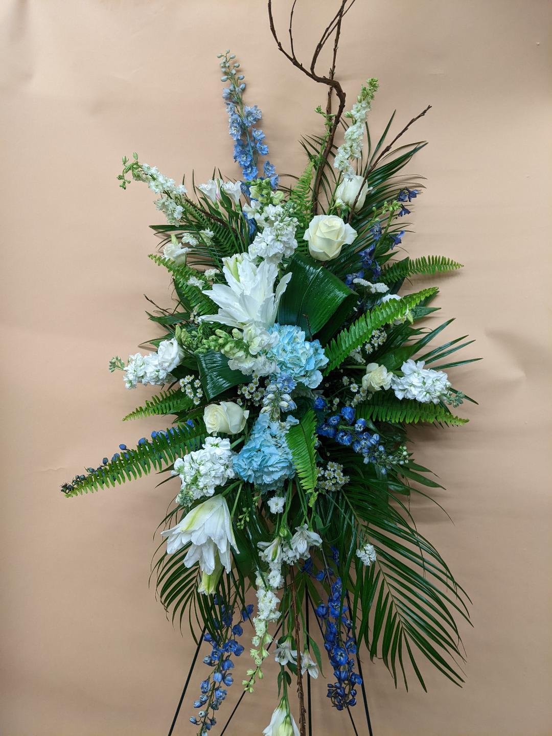 Blue and White Mixture Flowers Standing Spray premium price shown Blue and White Mixture Flowers Standing Spray premium price shown - Standing Spray Done in a Mixture of Blue & White Flowers COLORS CAN BE CHANGED TO YOUR LIKING