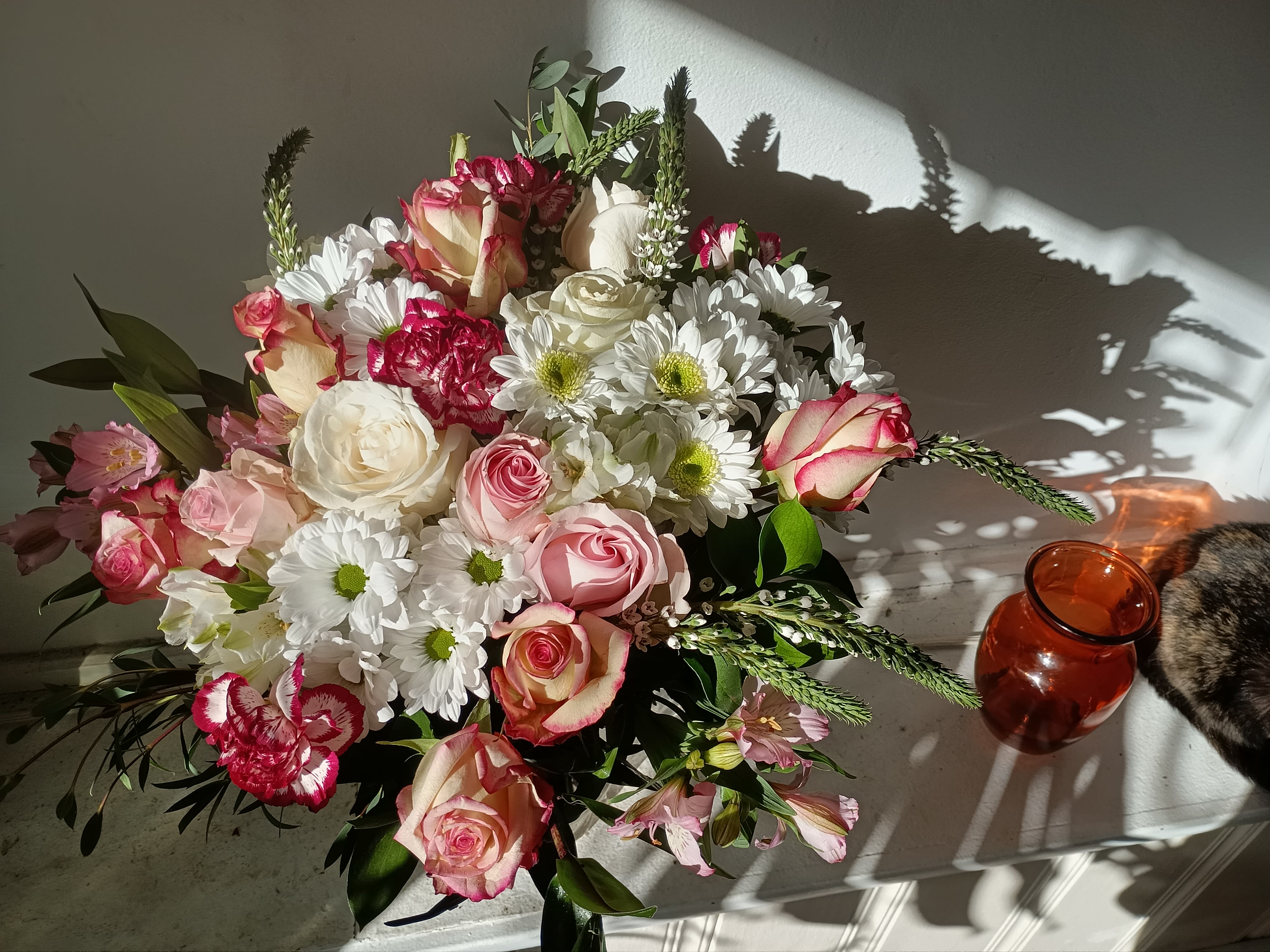 Andrea - Beautiful light colors of crispy white roses and daisies mixed with cream variegated roses and carnations and white and pink alstroemeria