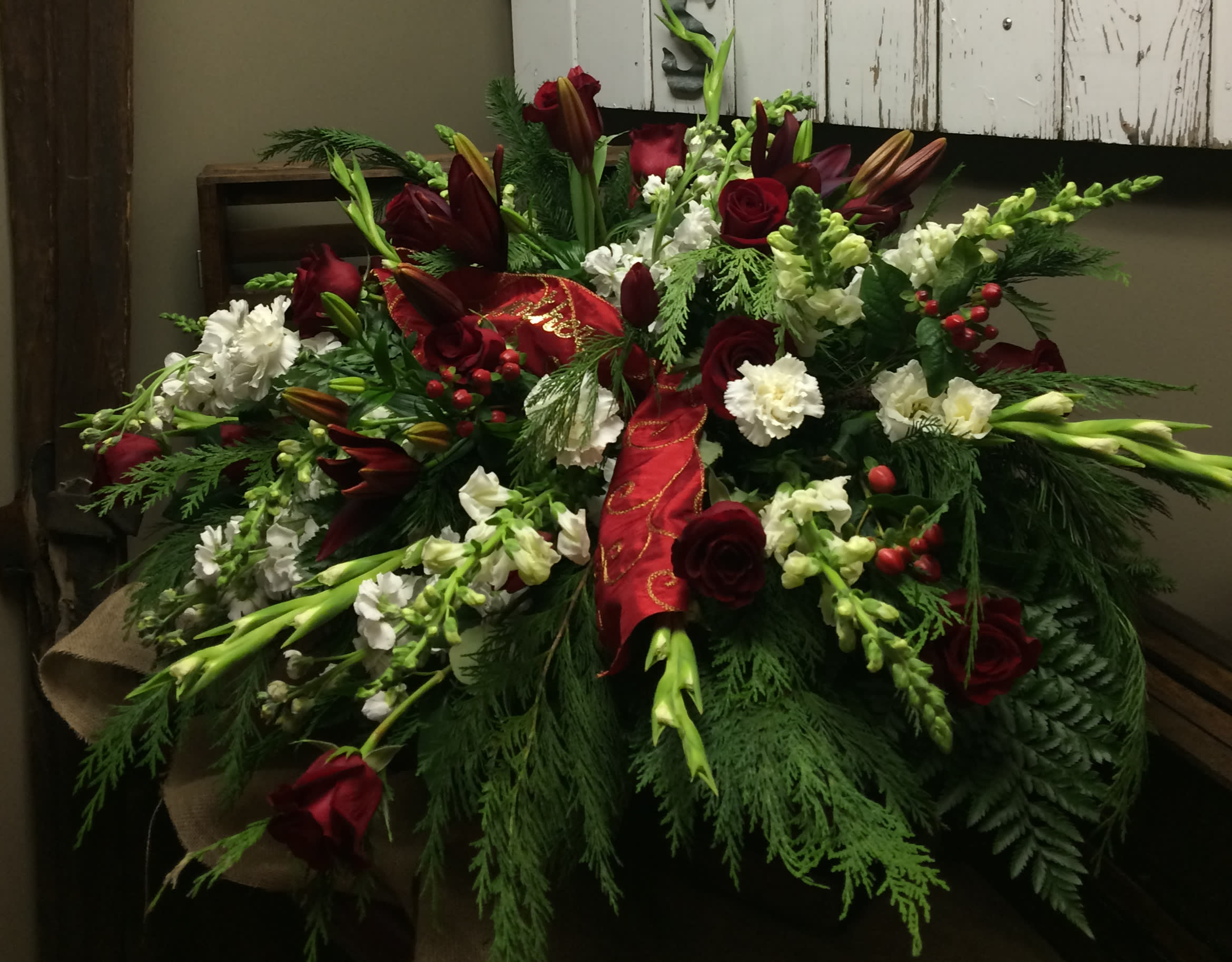 Heartfelt Thoughts and Prayers Custom Design by Cold Spring Floral - Casket Spray in Red and White with Roses, Gladiolas, Stock, Snapdragons, Carnations, Asiatic Lilies, Hypericum Berry and assorted Seasonal Greenery.