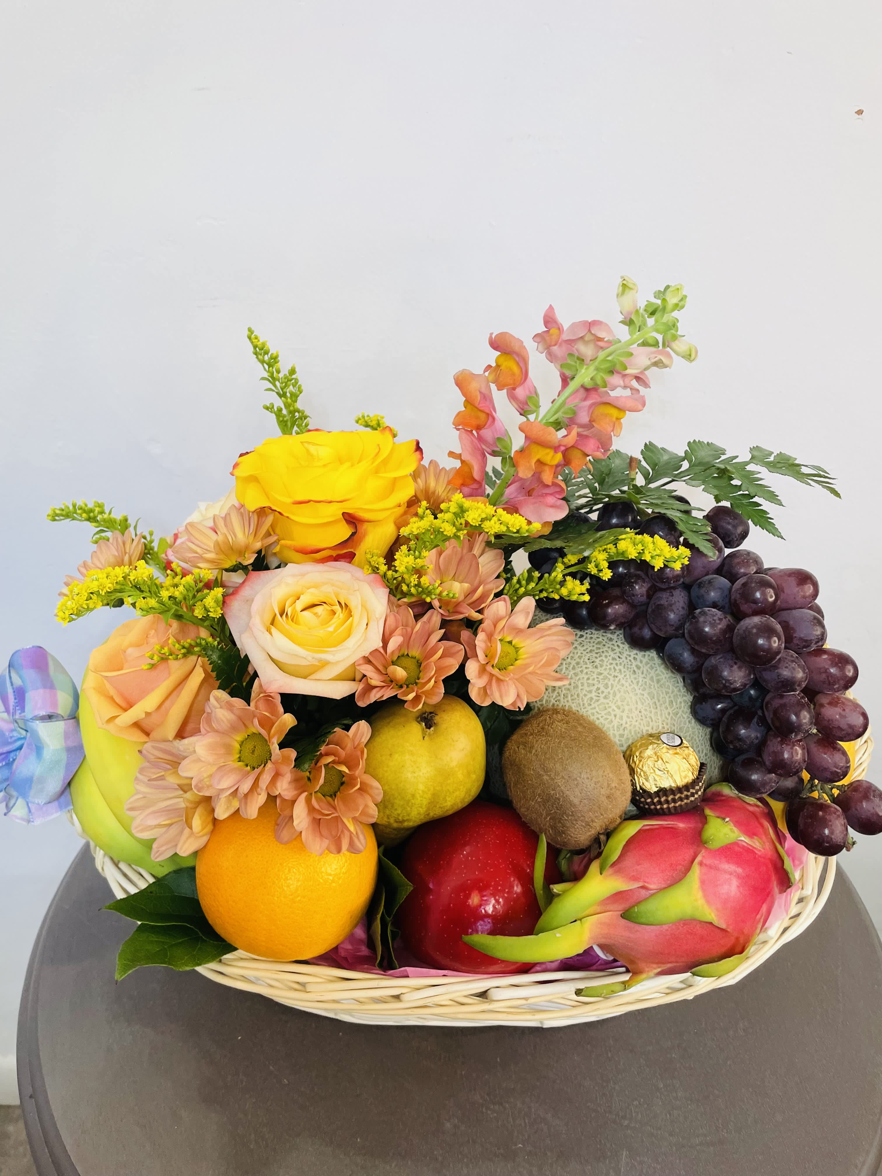 Floral &amp; Fruit Arrangement  - This lovely arrangement is the perfect gift to give to your loved one! Containing a little bit of everything, your loved one will definitely appreciate the gesture! 