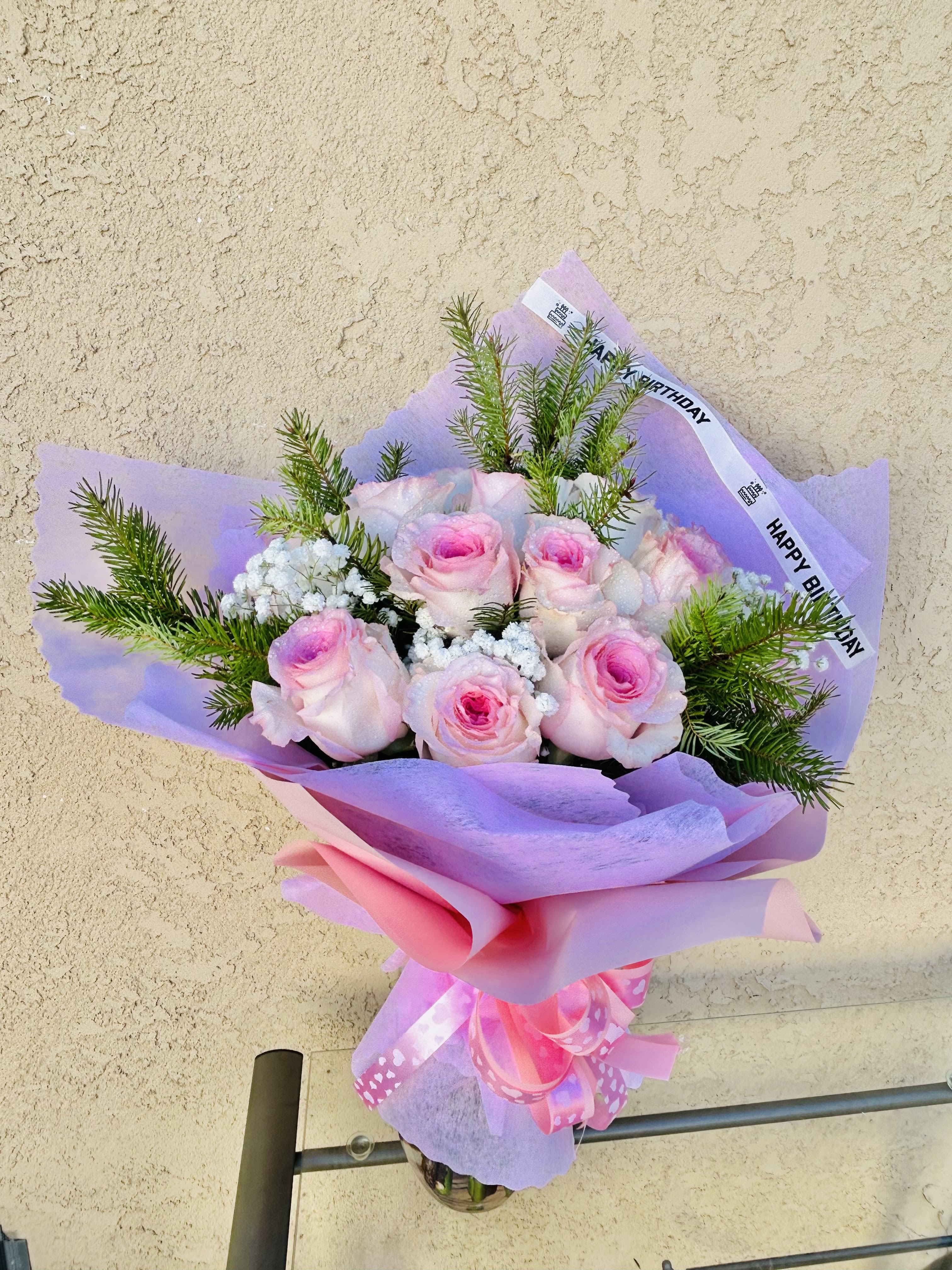 Pink Lining - Beautiful pink bouquet of pink roses, baby breathe and green accents. Optional: Happy Birthday ribbon 