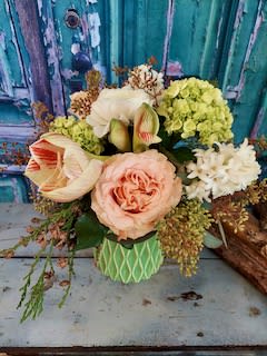 Confetti Bouquet Confetti Bouquet - Celebrate life's precious moments with our confetti bouquet. Adorned with amaryllis, roses, hyacinth and hydrangea...a classic bouquet to celebrate life's special moments. Container may vary.