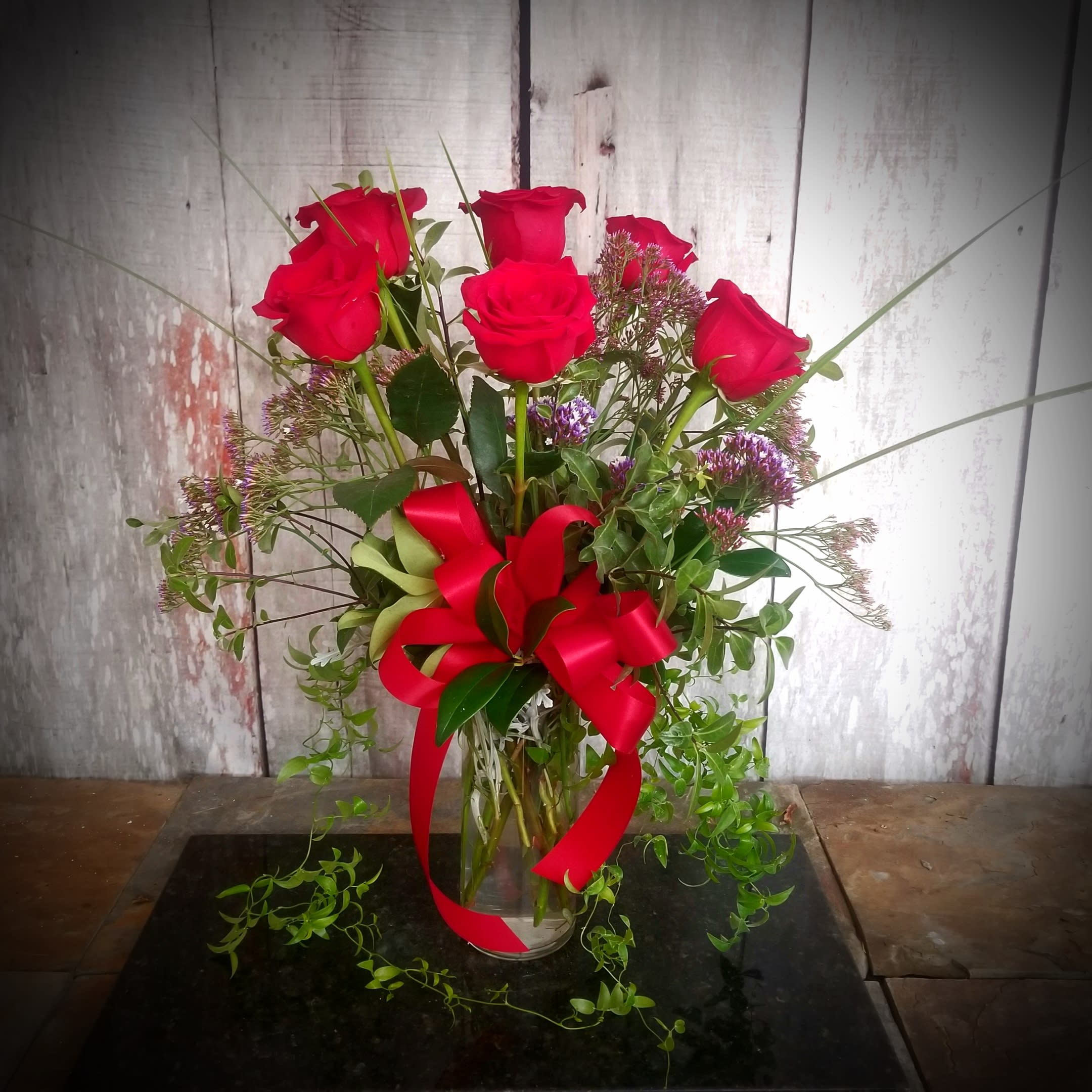 6 Luscious Roses - 6 beautiful roses designed more traditionally in a vase. Various colors available to please that special someone.