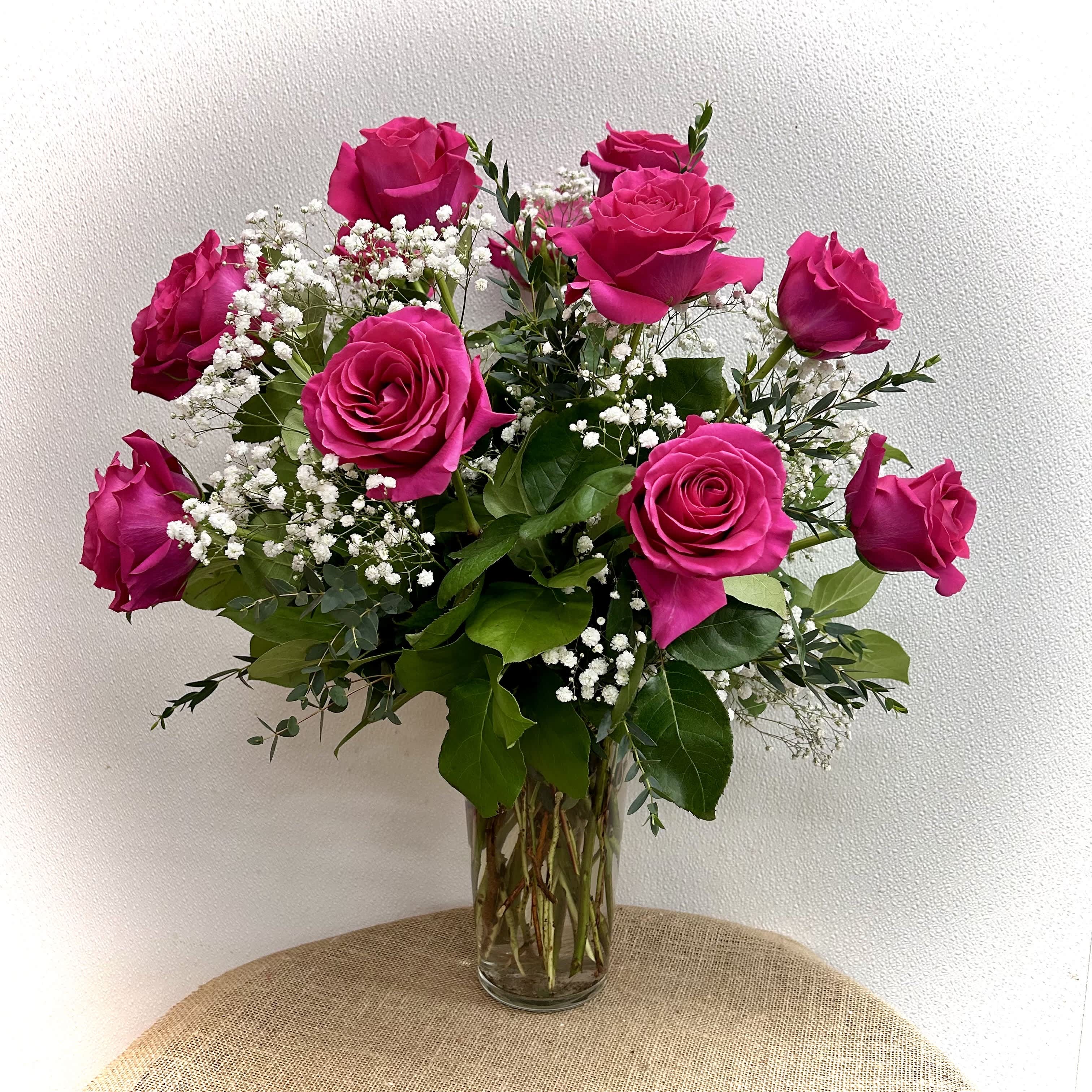 Rhapsody in Pink Rhapsody in Pink - Dozen Premium Rosprima Pink Floyd Roses in Designer Quality Vase with Greens & Babys Breath.