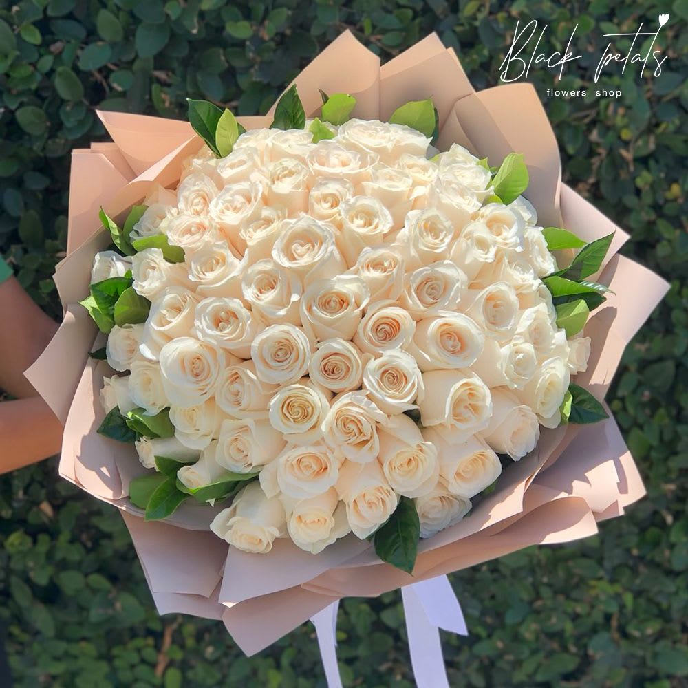 Timeless Elegance White Rose Hand-Tied Bouquet Timeless Elegance White Rose Hand-Tied Bouquet - Share the gift of pure elegance with this timeless Elegance White Rose Hand-Tied Bouquet, and let the white roses and green ruscus leaves convey your sentiments in the most sophisticated and heartfelt manner. Whether you're celebrating a cherished bond or offering solace, this arrangement stands as a timeless embodiment of the emotions that shape our lives. Disclaimer: Please note that this Timeless Elegance White Rose Hand-Tied Bouquet is a hand-tied arrangement by the best florists in Dubai and should be placed in a vase with water immediately upon receiving it. This will ensure that the flowers remain fresh and vibrant for an extended period. Arrangement includes: Fresh BP Signature roses & greenery PB iconic floral wrapping paper and ribbon Care instructions Custom greeting card DISCLAIMER: FRESH FLOWERS: These are fresh-cut flowers and are perishable. Please follow care instructions in Care & Handling