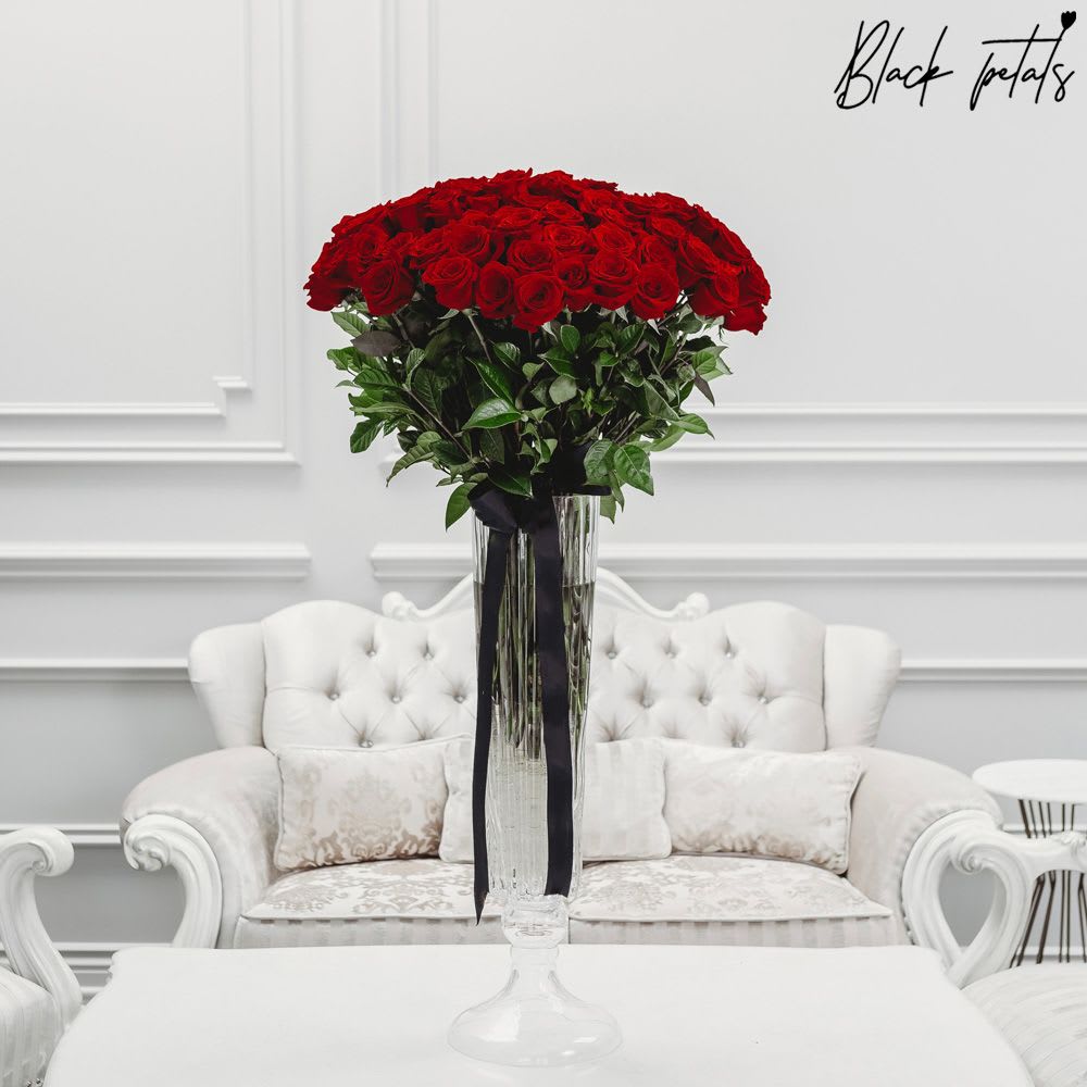 BP Long Stemmed Roses In A Vase BP Long Stemmed Roses In A Vase - To ensure and guarantee you receive the product, please order at least 3-4 days in advance. Luxurious long-stemmed roses are beautifully arranged in a classic tall crystal vase. The arrangement stands approx. 55 inches tall. Arrangement includes: Fresh Black Petal Signature Long Stemmed Roses BP Tall Crystal Vase Care instructions Custom greeting card DISCLAIMER - FRESH FLOWERS: These are fresh cut flowers and are perishable. Please follow care & instructions. Please note that if no variations from the list are chosen, you will receive the featured arrangement unless a substitution may need to be made based on the season, availability of flowers, or other unforeseen and uncontrollable circumstances occur. By making a purchase on this website, the customer authorizes substitutions within a specific color palette. Necessary substitutions to the arrangement will be at the designer?s discretion.
