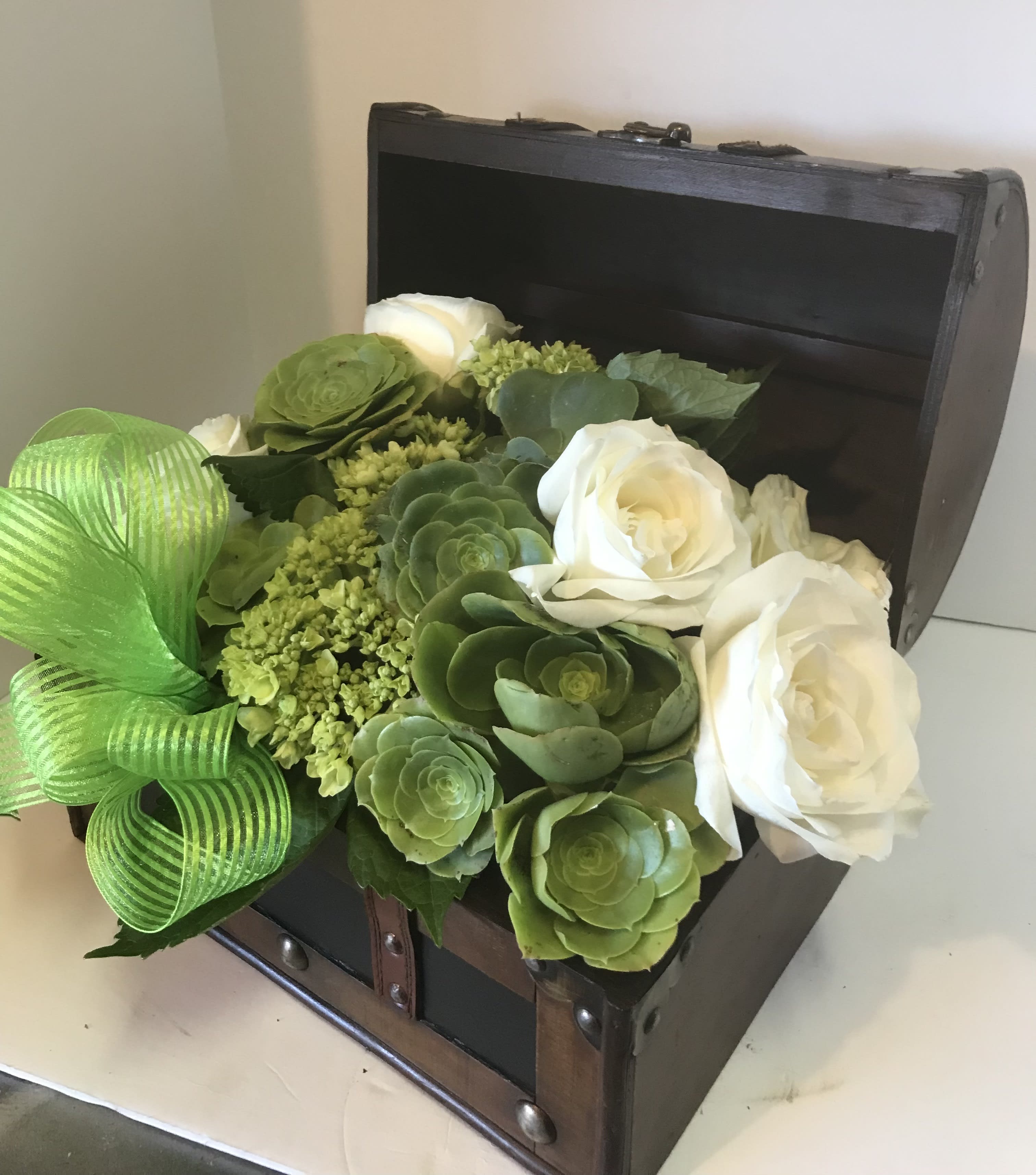 SUCCULENTS AND ROSES - A CUSTOM REUSABLE BOX FILLED WITH  SUCCULENTS AND WHITE SEASONAL BLOOMS.