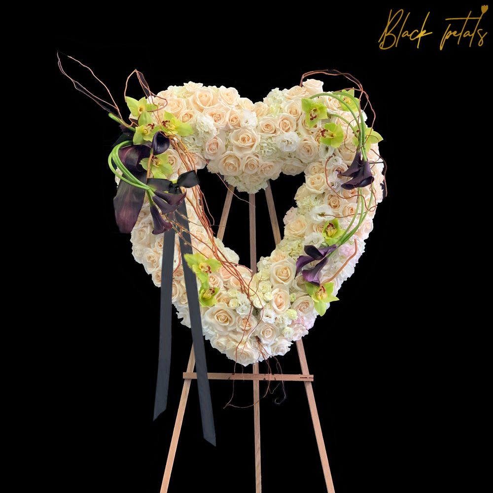 White Love BP Sympathy Standing Heart White Love BP Sympathy Standing Heart - The enduring love you feel for them will keep them always in your heart. This sentiment is captured with our standing heart shaped arrangement in white handcrafted by BP expert designers featuring white roses, calla lilies and orchids. DISCLAIMER - FRESH FLOWERS:яThese are fresh cut flowers and are perishable. я Please note that if no variations from the list are chosen, you will receive the featured arrangement unless a substitution may need to be made based on the season, availability of flowers, or other unforeseen and uncontrollable circumstances occur. By making a purchase on this website, the customer authorizes substitutions within a specific color palette. Necessary substitutions to the arrangement will be at the designer?s discretion.