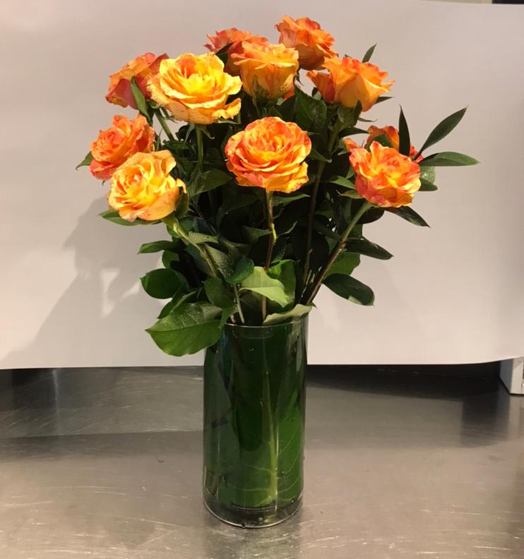 Custom Vase Arrangement of Orange Roses - Custom vase arrangement of orange roses with choice greens.  *Regular is 1 dozen roses *Deluxe is 2 dozen roses *Premium is 3 dozen roses