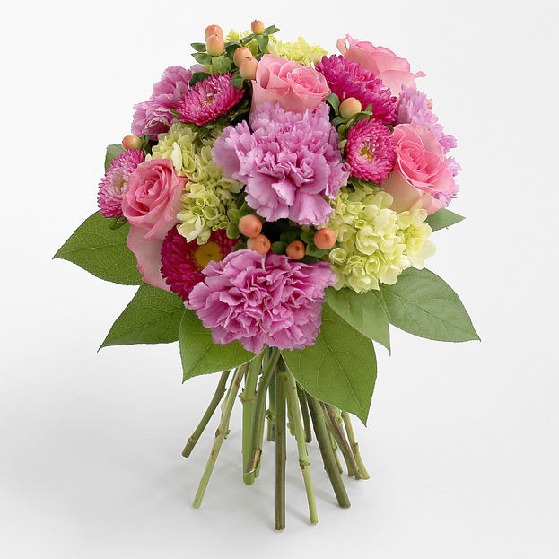 Assorted Blooms Bouquet - Brighten their day with this warm and  exciting mix featuring roses, hydrangea asters and the exclusive lavender moon carnations.  