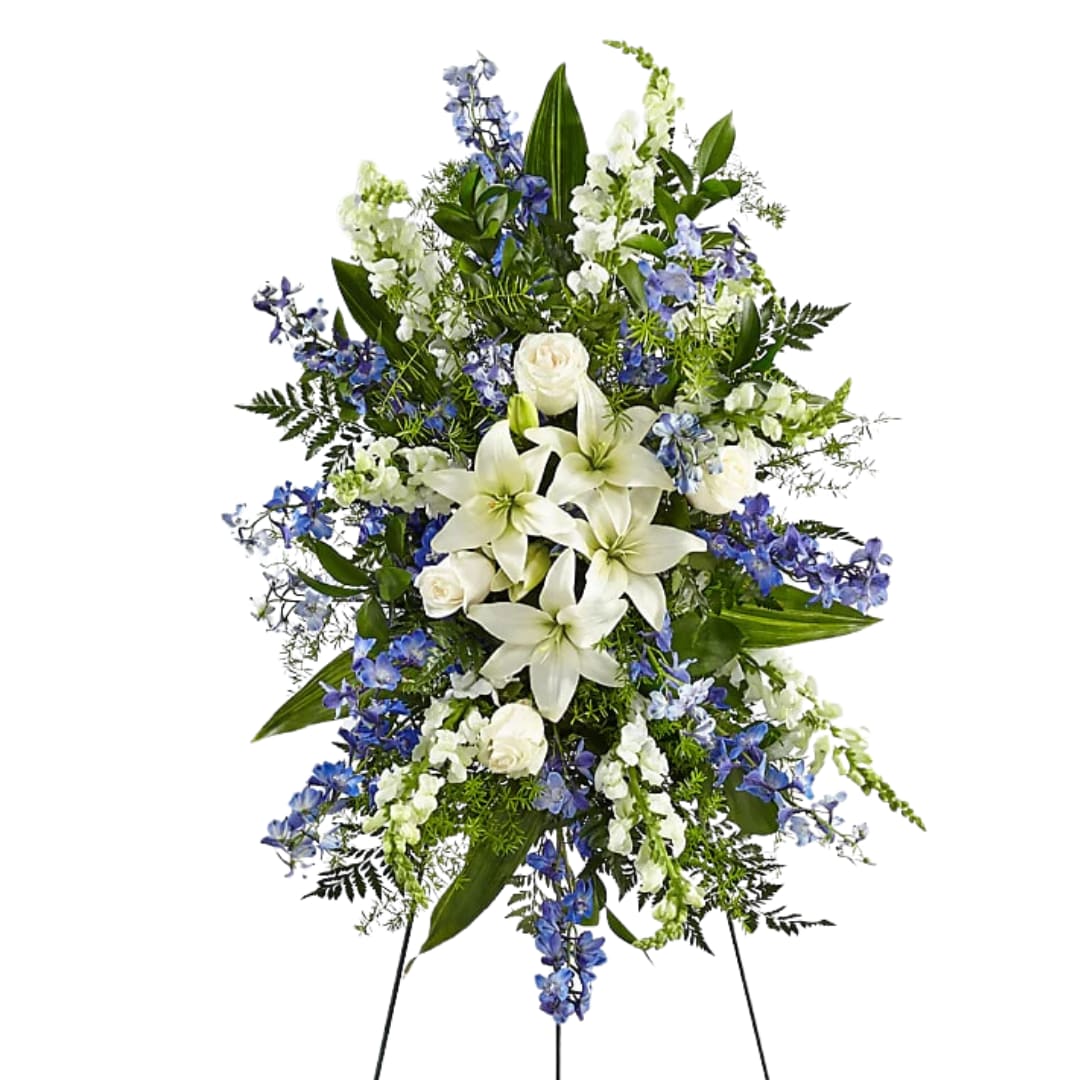 Heartfelt Blue Spray - Serving as a timeless tribute to honor and celebrate the life of a loved one, this exquisite standing spray features a combination of soft florals symbolic of everlasting love.